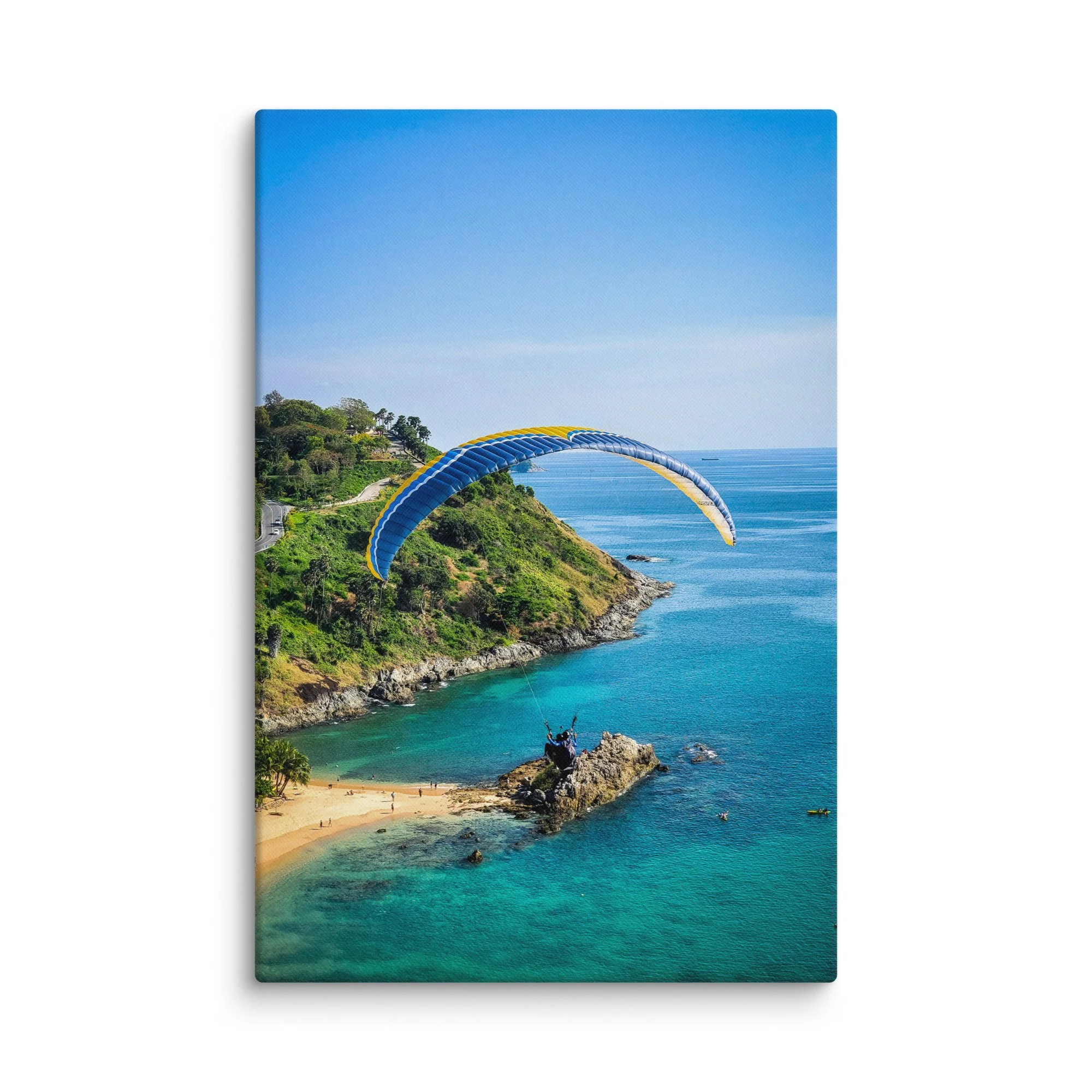 Paraglider soaring over turquoise cove and rugged coastline in Phuket, Thailand with blue sky – adventure travel photography canvas print wall art decor