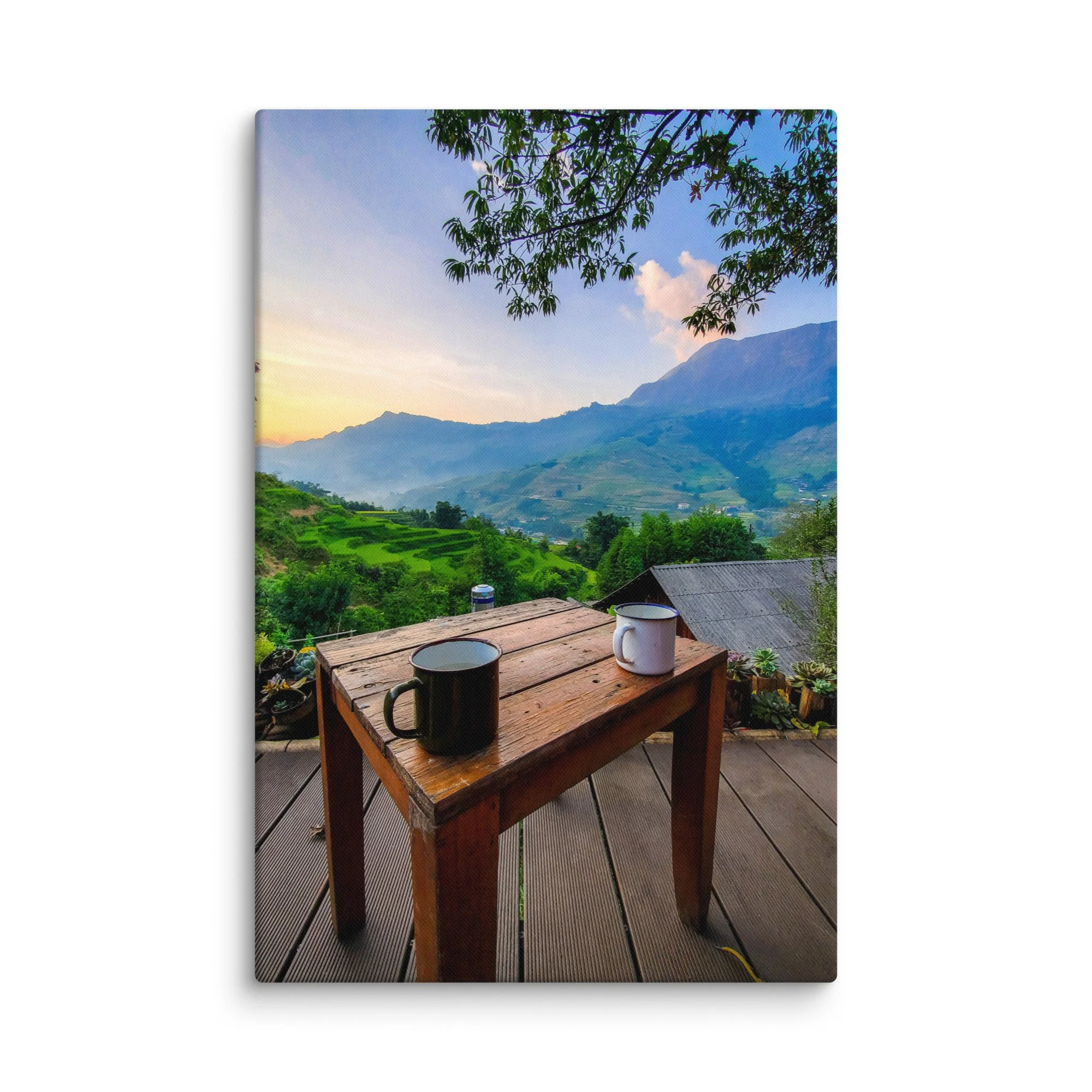 Enamel mug on wooden table overlooking misty rice terraces and mountains in Sapa, Vietnam at sunrise – northern highland travel photography canvas print wall art decor