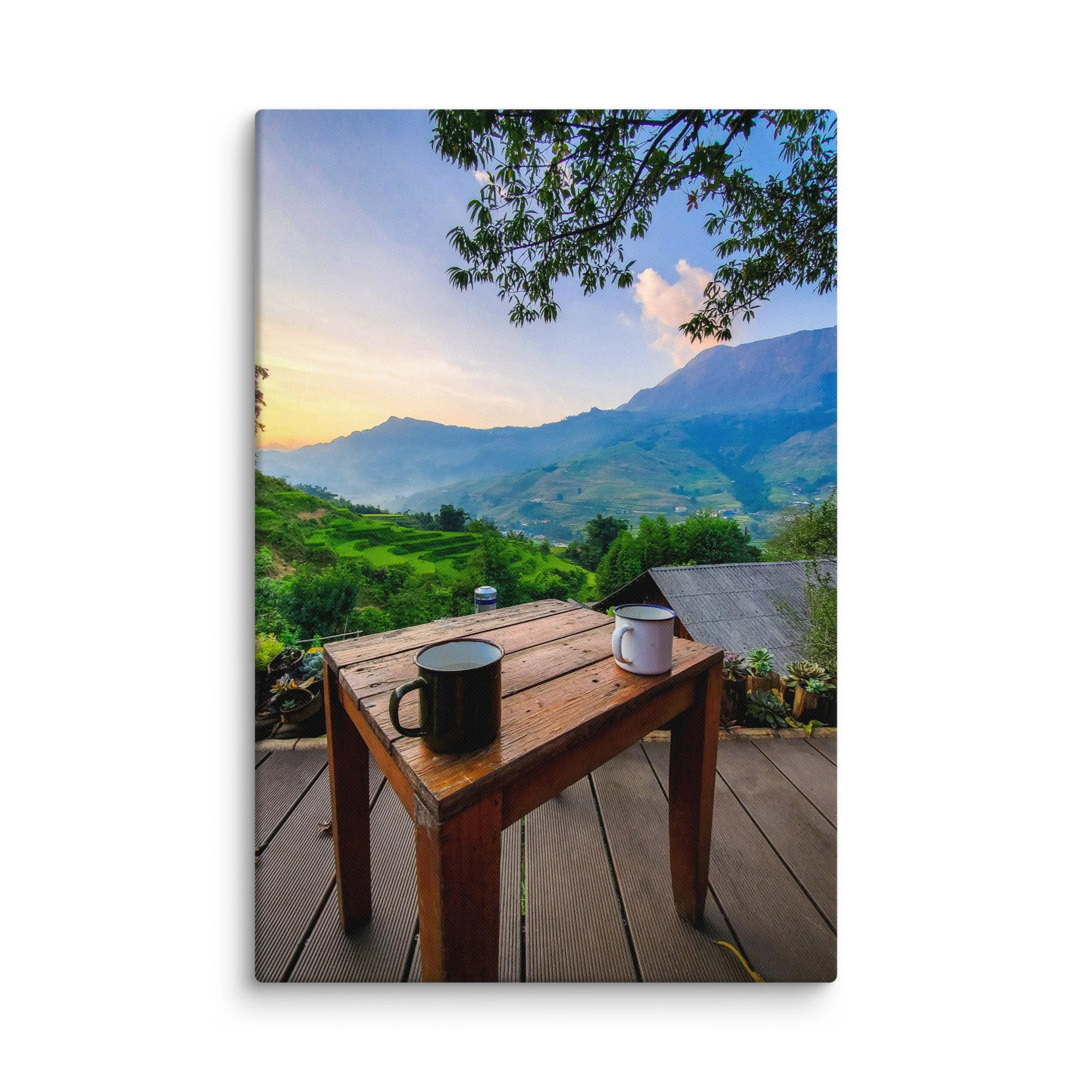 Enamel mug on wooden table overlooking misty rice terraces and mountains in Sapa, Vietnam at sunrise – northern highland travel photography canvas print wall art decor