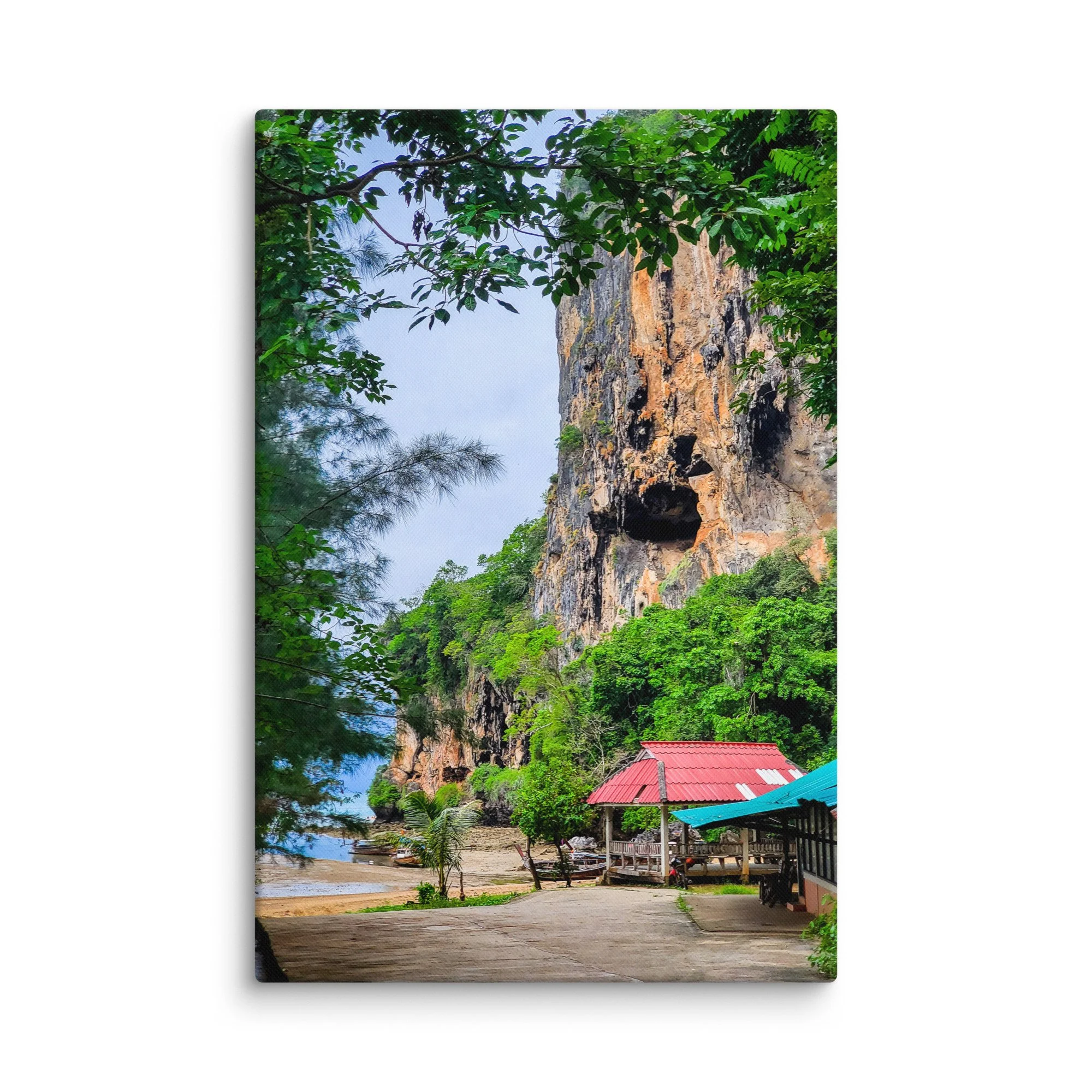 Dramatic limestone cliff and lush greenery overlooking Tonsai Beach, Krabi, Thailand with turquoise water and longtail boats – tropical travel photography canvas print wall art decor