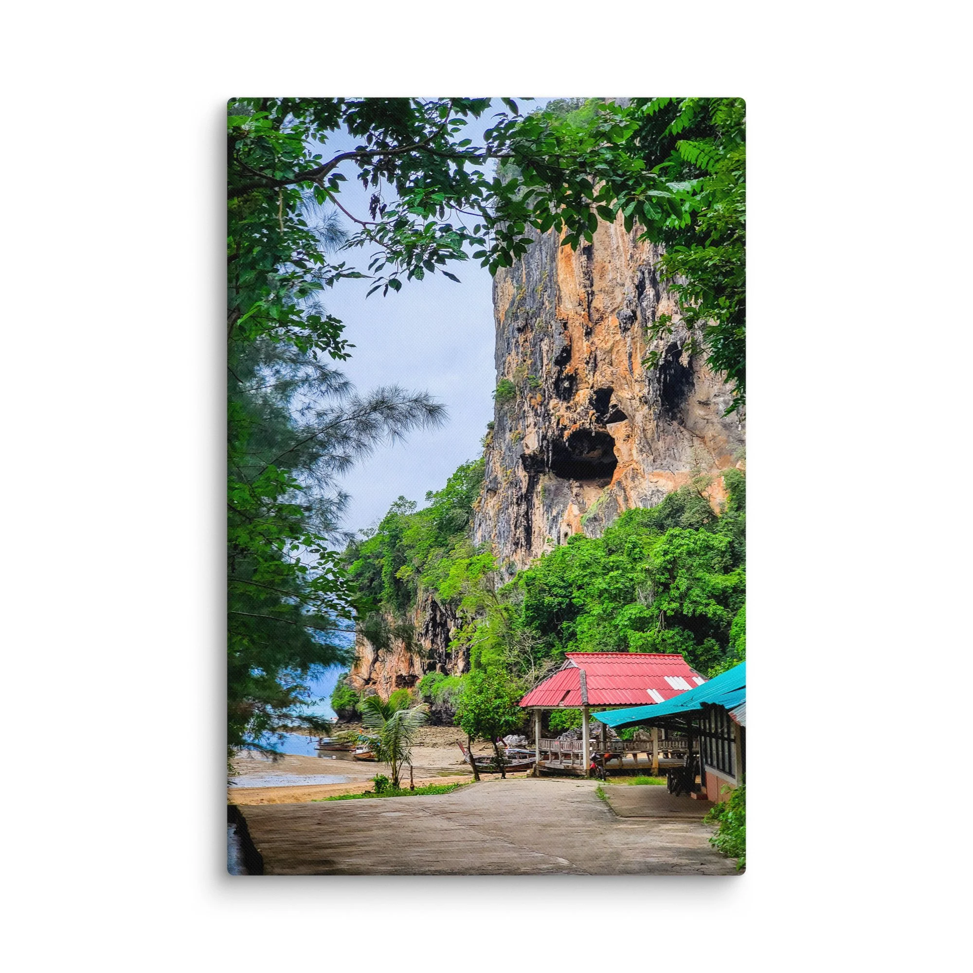 Dramatic limestone cliff and lush greenery overlooking Tonsai Beach, Krabi, Thailand with turquoise water and longtail boats – tropical travel photography canvas print wall art decor