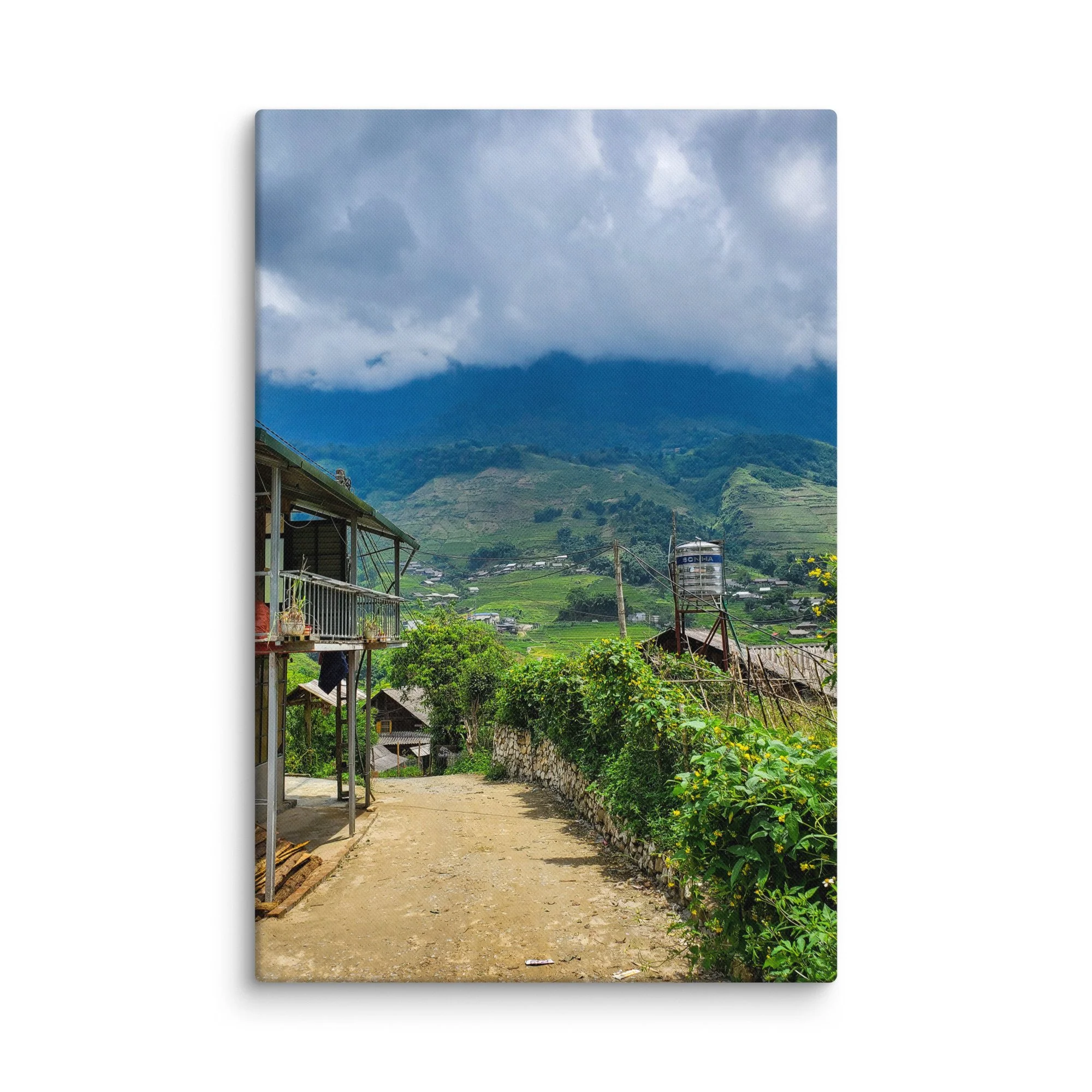 Misty mountain village in Sapa, Vietnam with stilt houses, stone path and endless green rice terraces under dramatic clouds – northern highland travel photography canvas print wall art decor