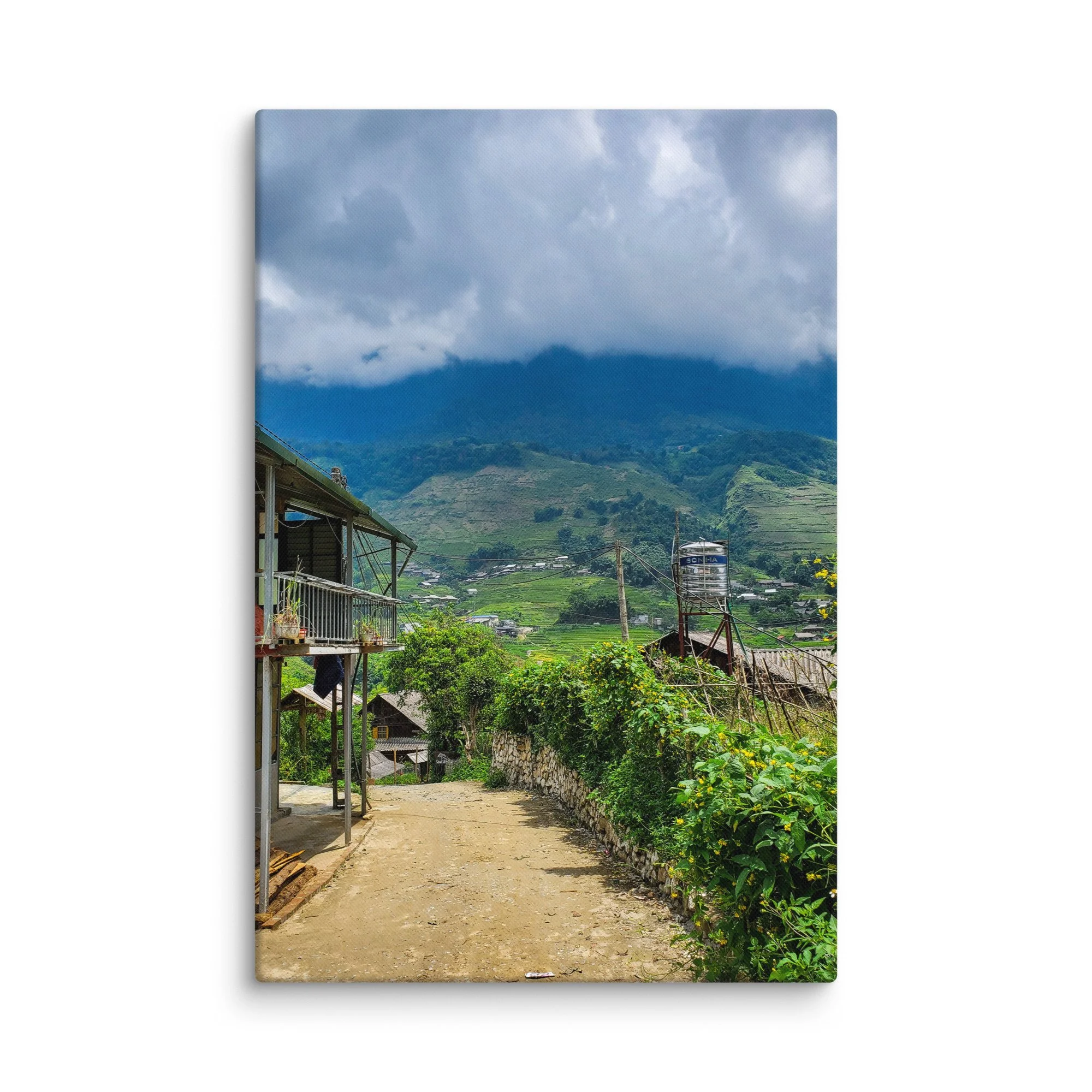 Misty mountain village in Sapa, Vietnam with stilt houses, stone path and endless green rice terraces under dramatic clouds – northern highland travel photography canvas print wall art decor