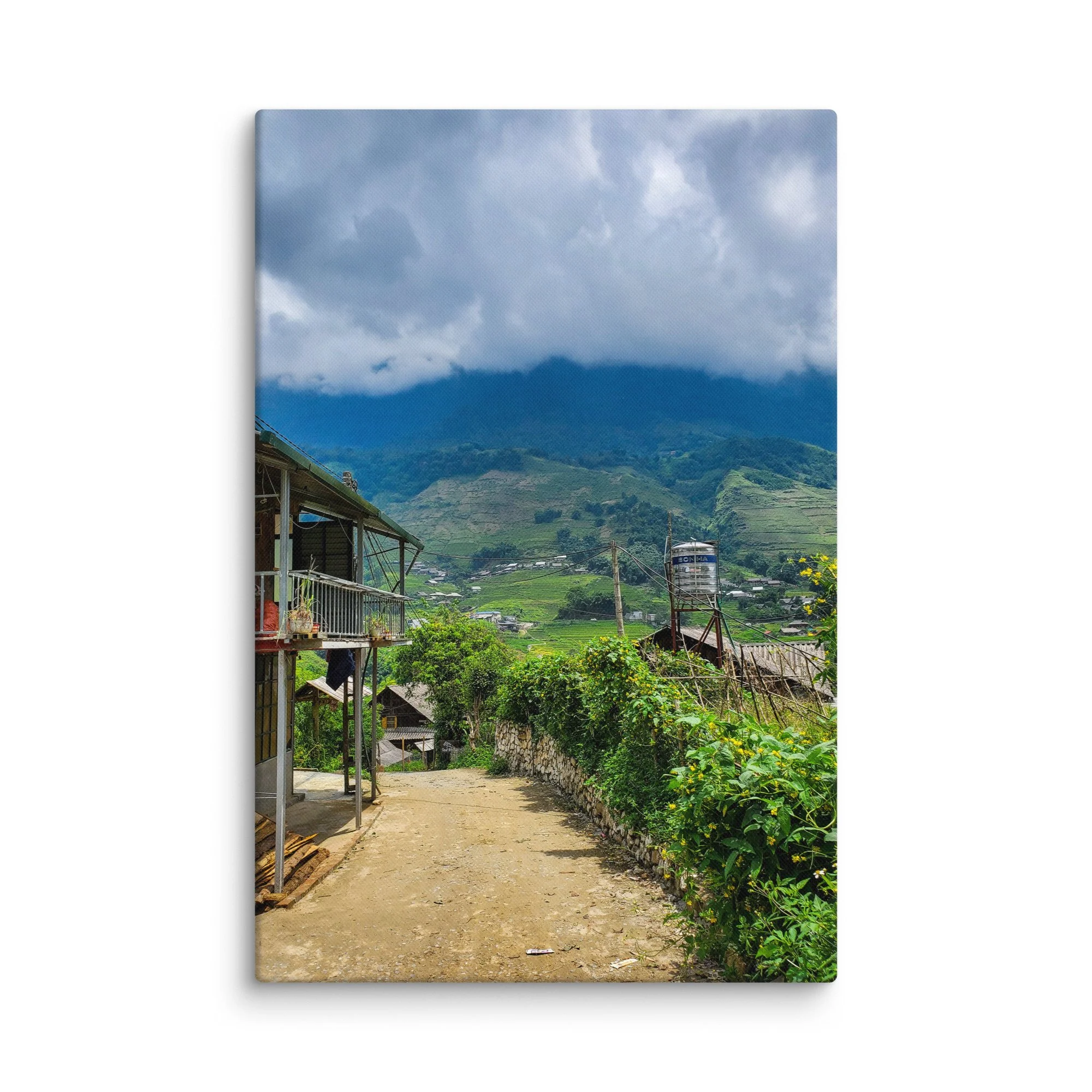 Misty mountain village in Sapa, Vietnam with stilt houses, stone path and endless green rice terraces under dramatic clouds – northern highland travel photography canvas print wall art decor