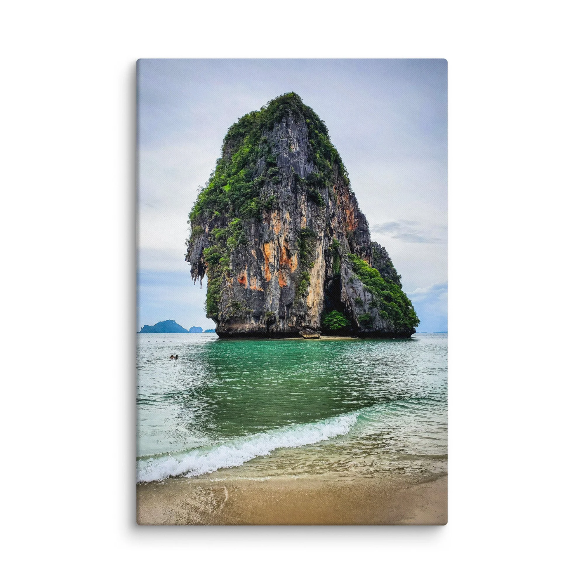 Towering limestone karst pinnacle rising from turquoise waters at Railay or Phra Nang Beach, Krabi, Thailand under soft sky – tropical travel photography canvas print wall art decor