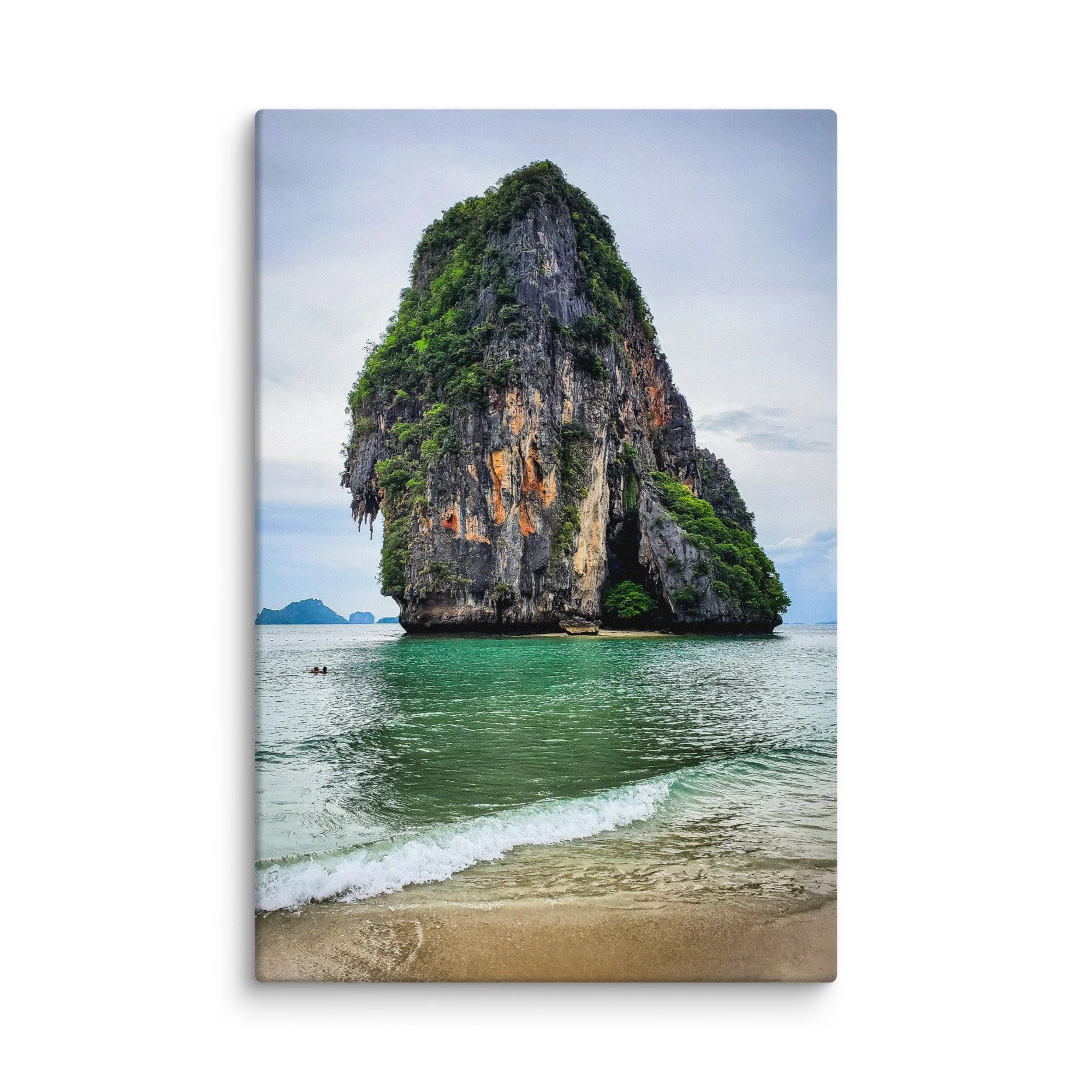 Towering limestone karst pinnacle rising from turquoise waters at Railay or Phra Nang Beach, Krabi, Thailand under soft sky – tropical travel photography canvas print wall art decor