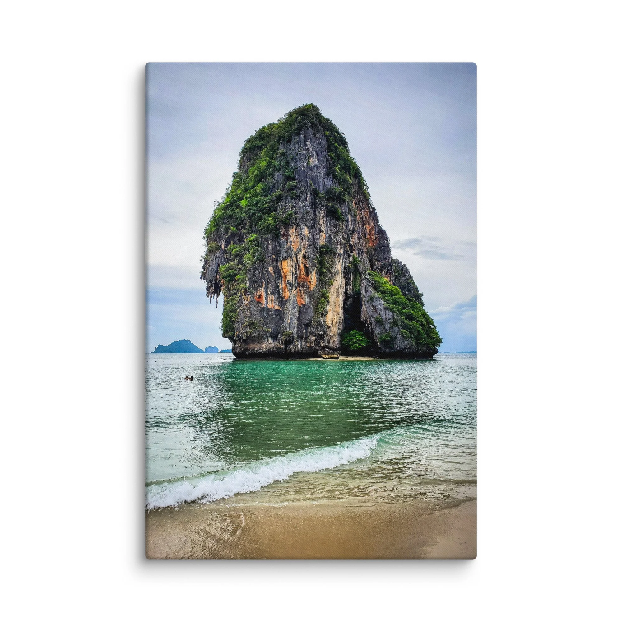 Towering limestone karst pinnacle rising from turquoise waters at Railay or Phra Nang Beach, Krabi, Thailand under soft sky – tropical travel photography canvas print wall art decor