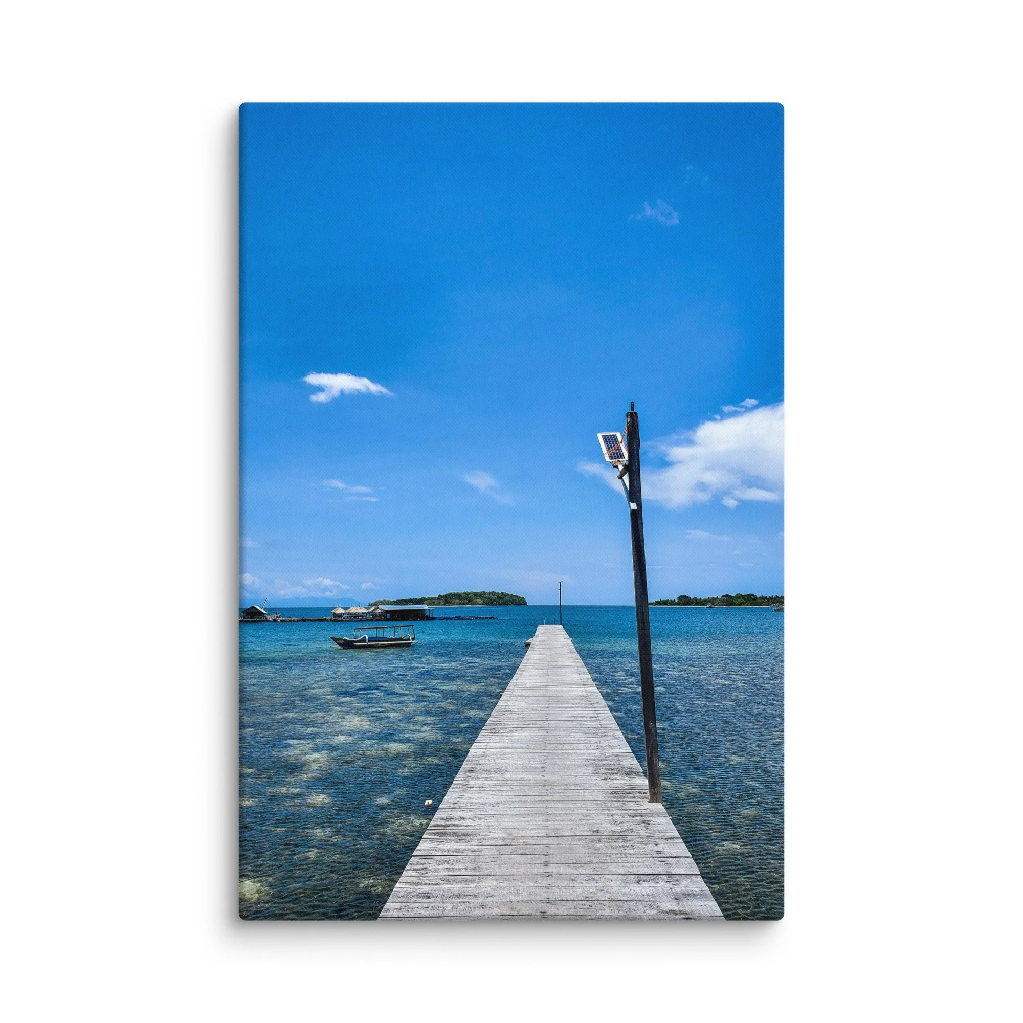 Long wooden pier extending into crystal-clear turquoise waters with distant green islands and solar lamp in Thailand – tropical travel photography canvas print wall art decor
