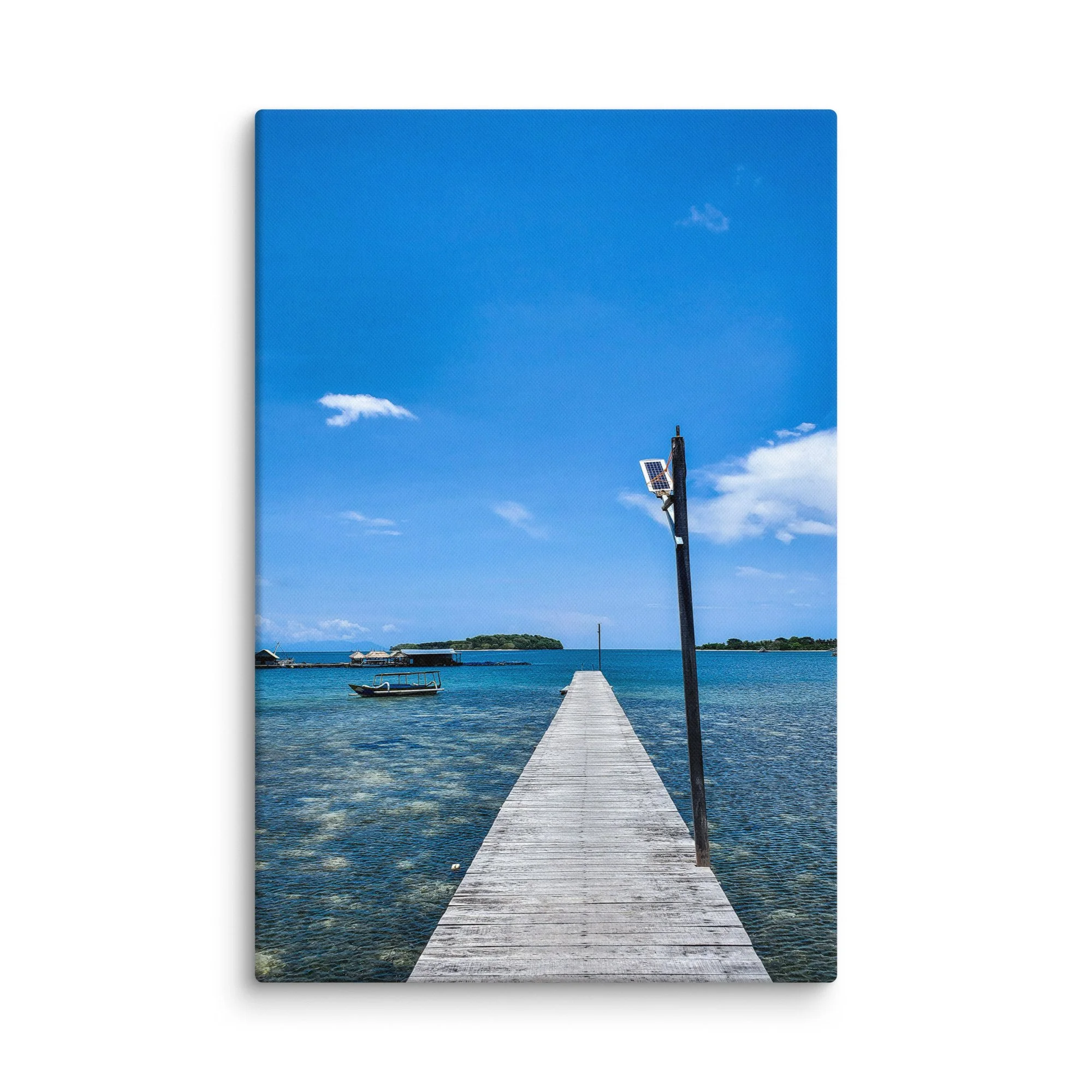 Long wooden pier extending into crystal-clear turquoise waters with distant green islands and solar lamp in Thailand – tropical travel photography canvas print wall art decor