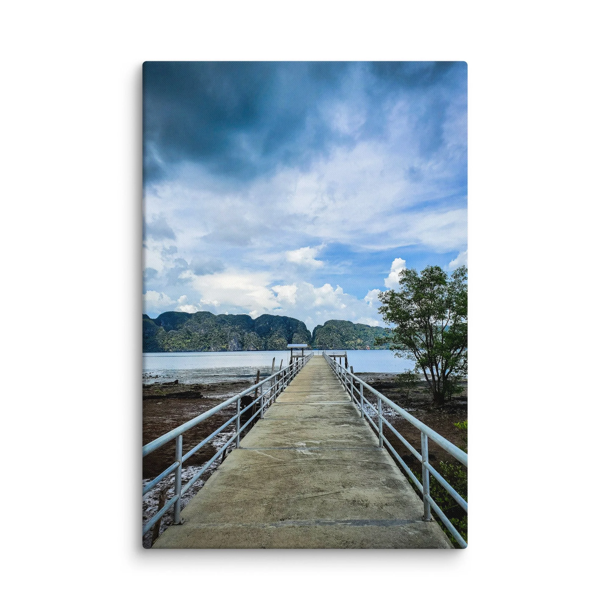 Long pier extending into turquoise waters surrounded by limestone karst mountains and rainforest in Thailand under dramatic sky – tropical travel photography canvas print wall art decor