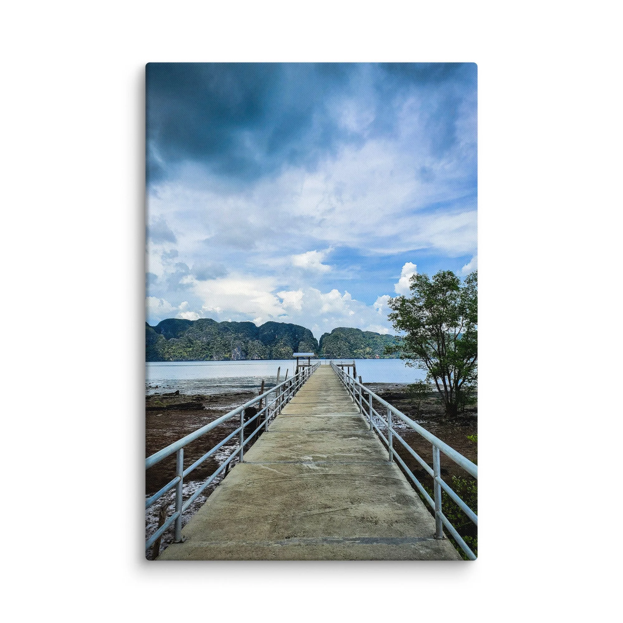 Long pier extending into turquoise waters surrounded by limestone karst mountains and rainforest in Thailand under dramatic sky – tropical travel photography canvas print wall art decor