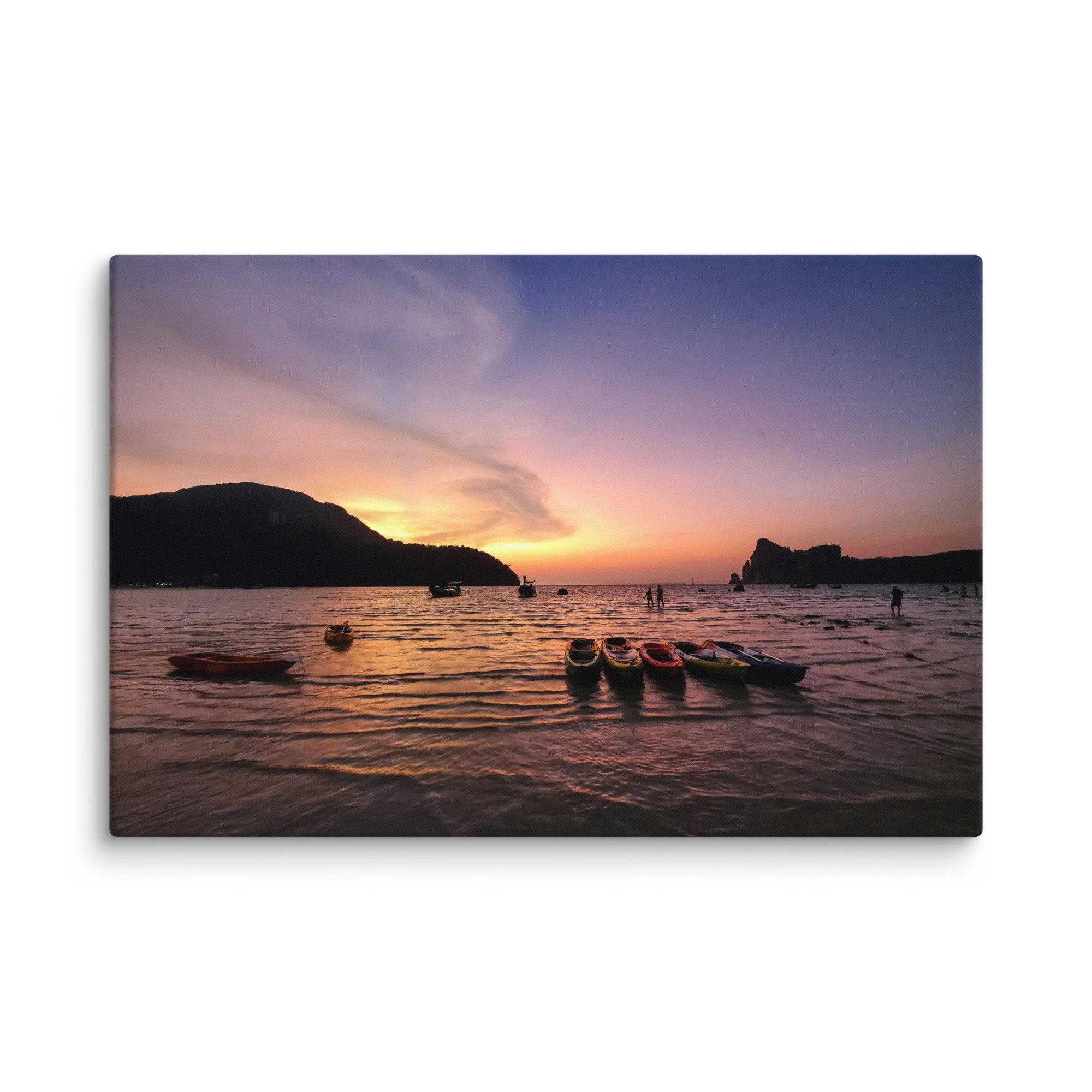 Colorful kayaks and longtail boats at sunset in Phi Phi Islands, Thailand with purple-pink sky and calm sea – tropical travel photography canvas print wall art decor