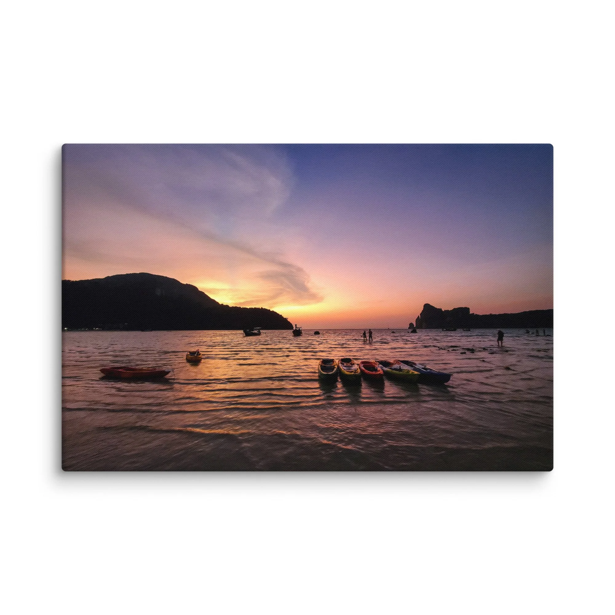 Colorful kayaks and longtail boats at sunset in Phi Phi Islands, Thailand with purple-pink sky and calm sea – tropical travel photography canvas print wall art decor