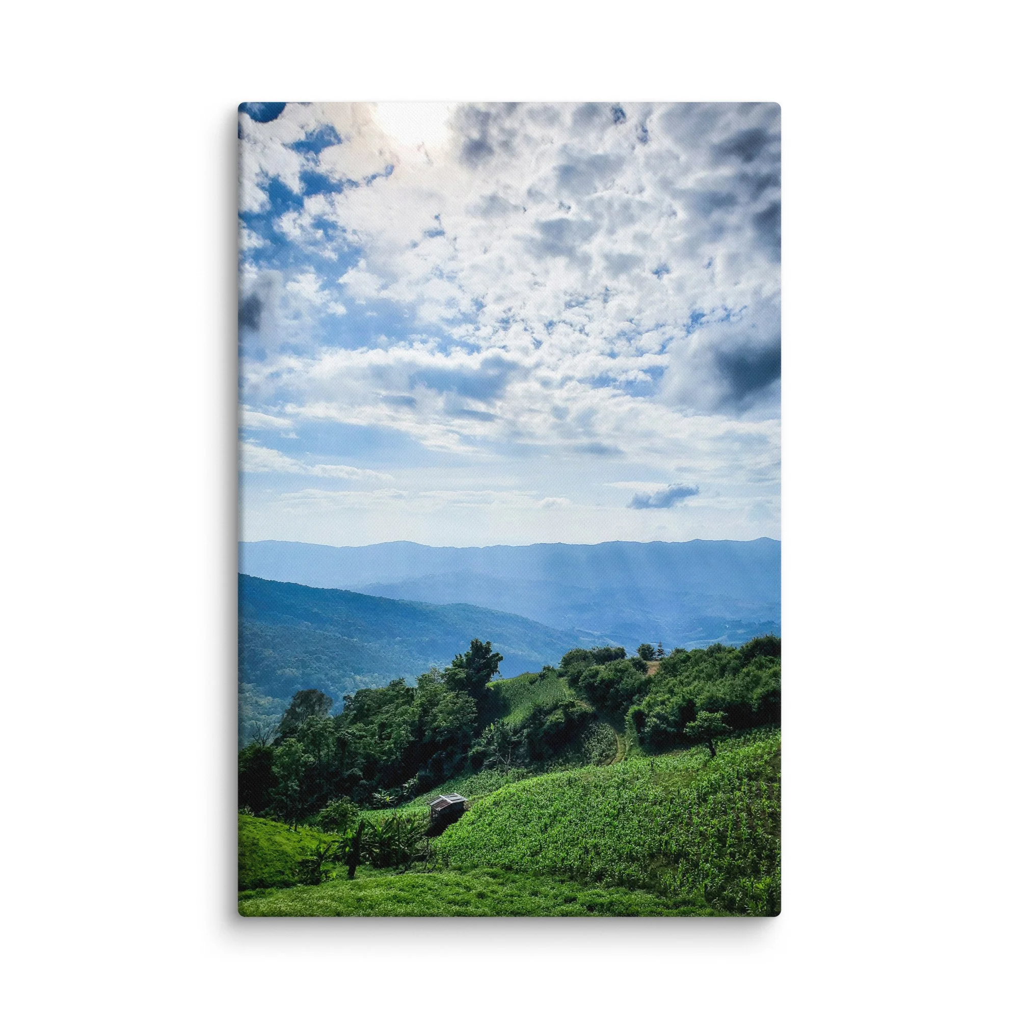 Lush green cornfields on rolling hills with misty karst mountains in northern Vietnam (Hà Giang) under dramatic sky – highland travel photography canvas print wall art decor