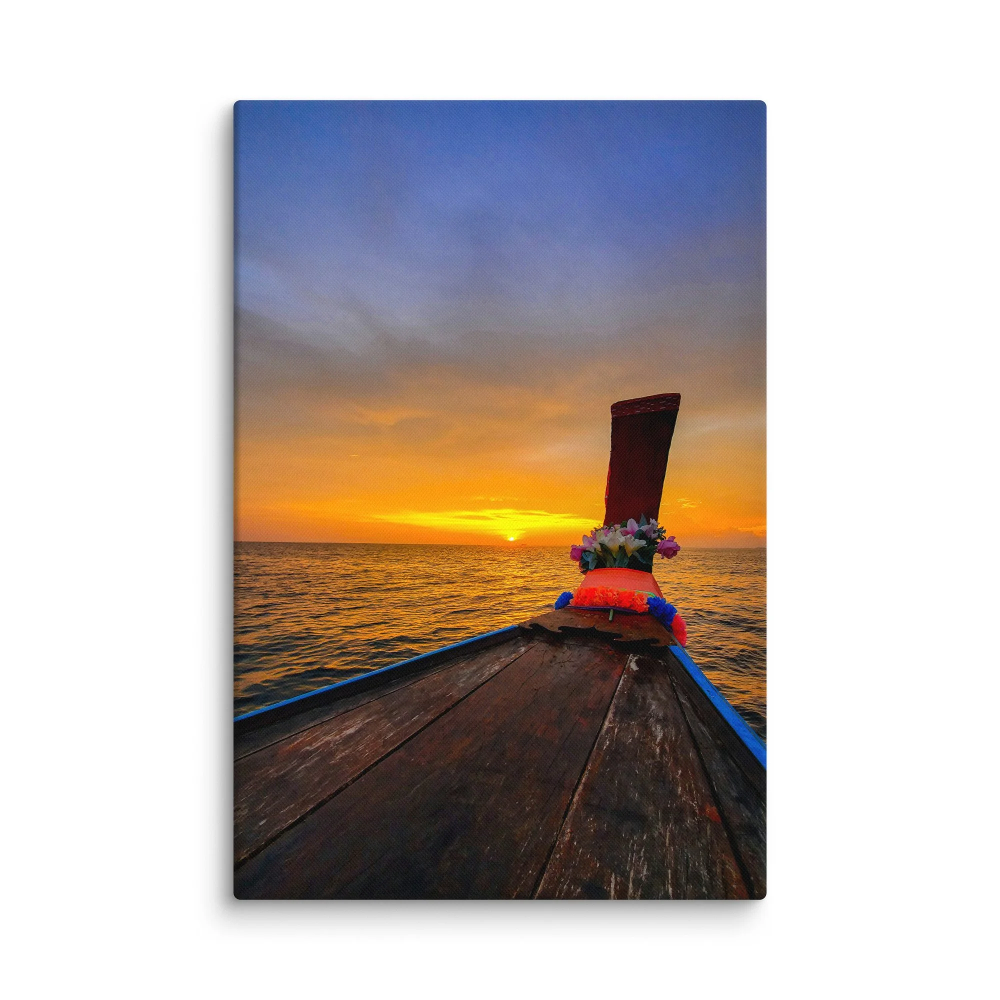 Ornate longtail boat bow with floral garlands facing golden sunset over calm sea in Thailand – tropical travel photography canvas print wall art decor