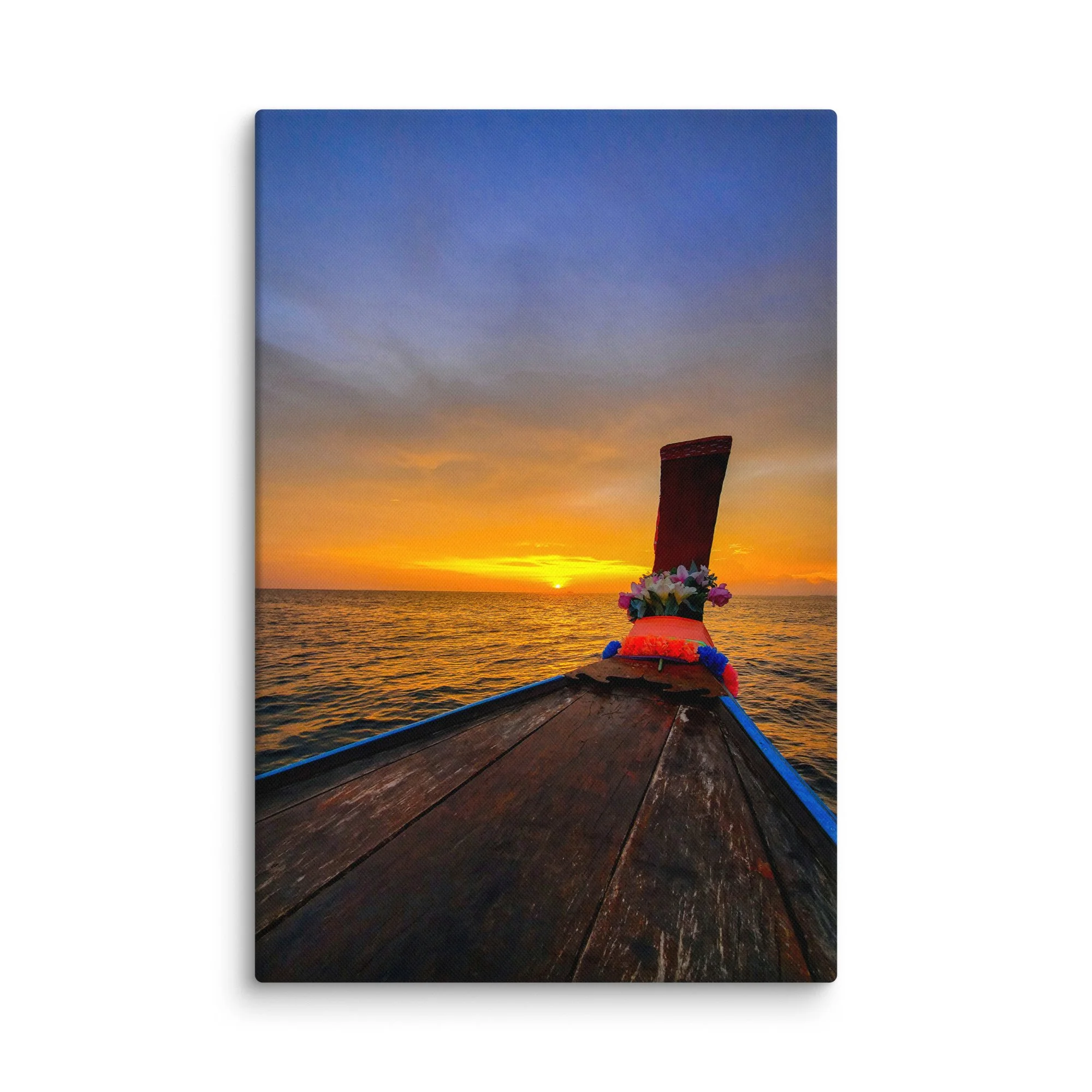 Ornate longtail boat bow with floral garlands facing golden sunset over calm sea in Thailand – tropical travel photography canvas print wall art decor