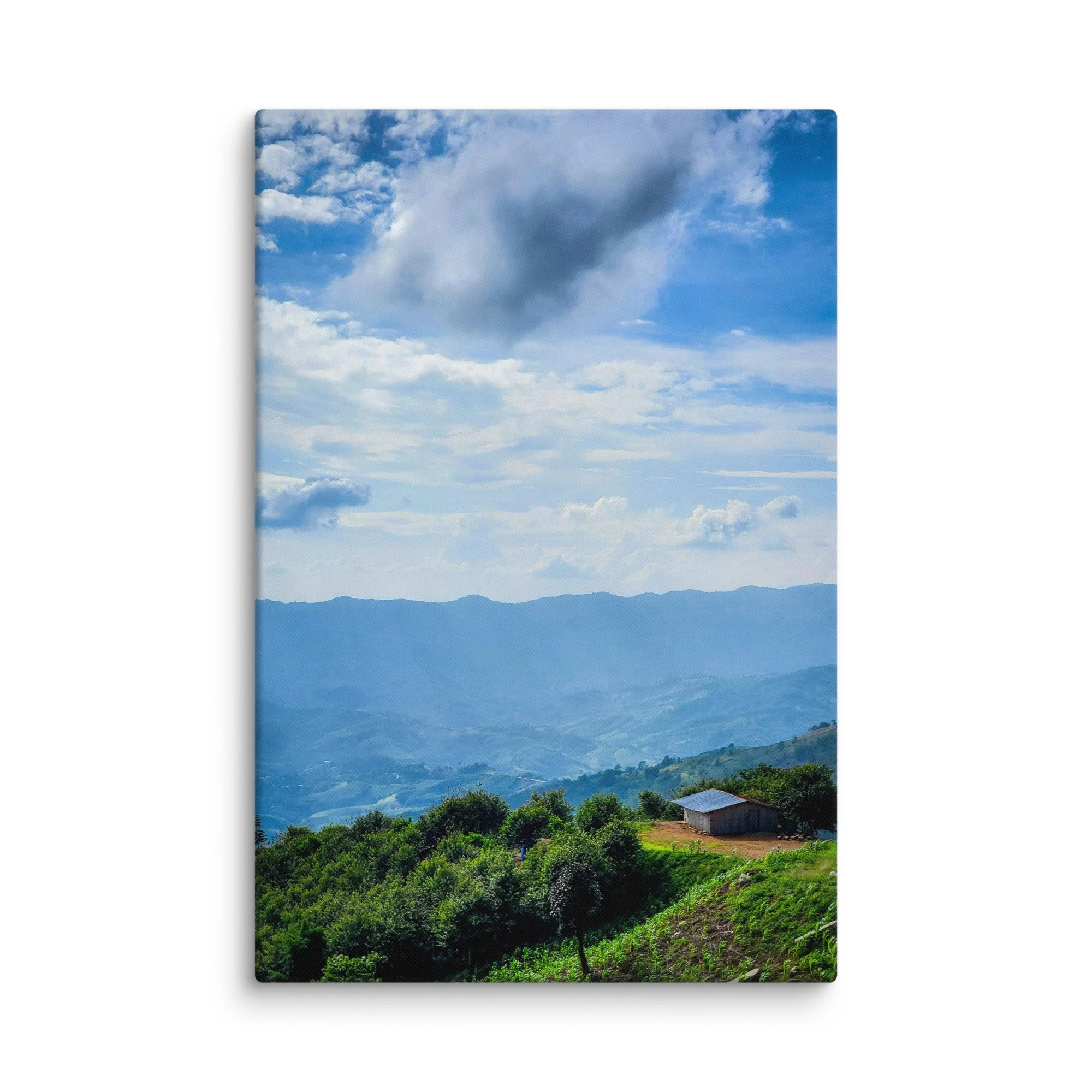 Panoramic view of misty green valleys and layered karst mountains with a small house in northern Vietnam (Hà Giang) under dramatic sky – highland travel photography canvas print wall art