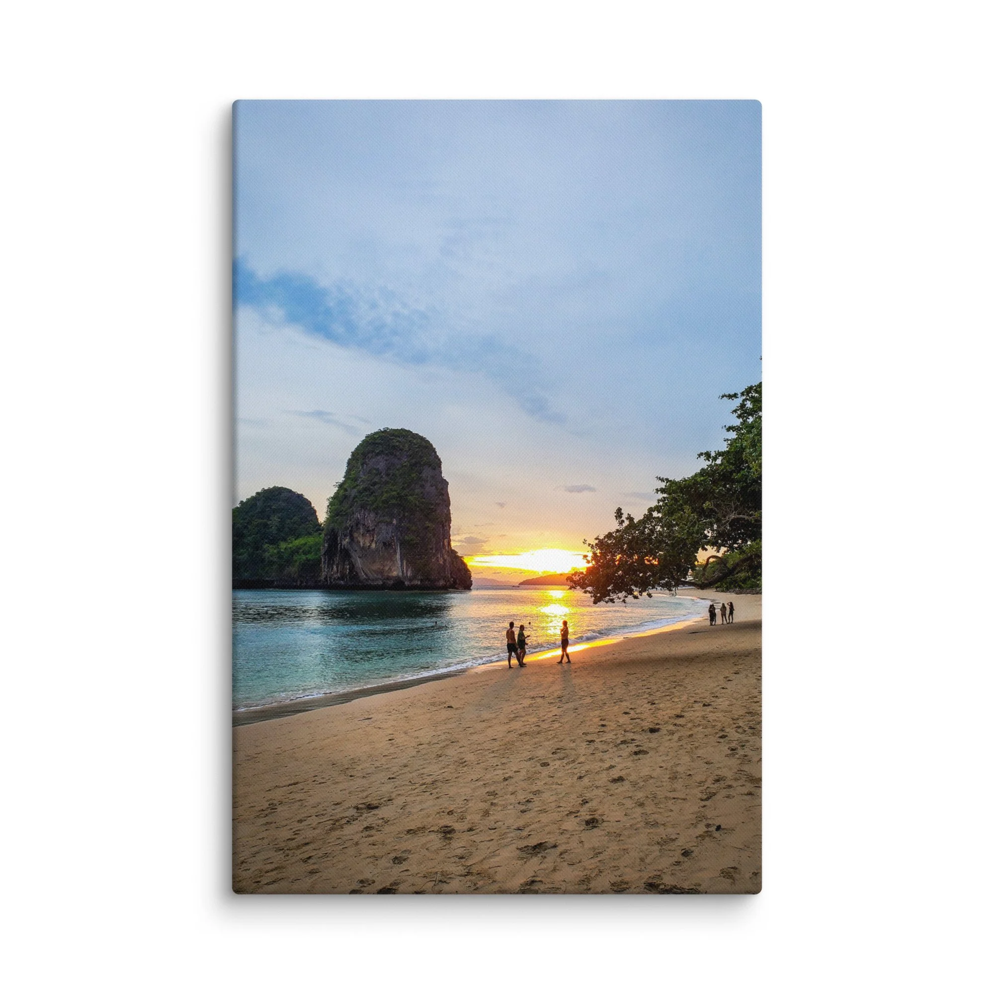 Sunset over turquoise sea at Railay or Phra Nang Beach, Krabi, Thailand with karst formations, longtail boats and people strolling on the sand – tropical travel photography canvas print