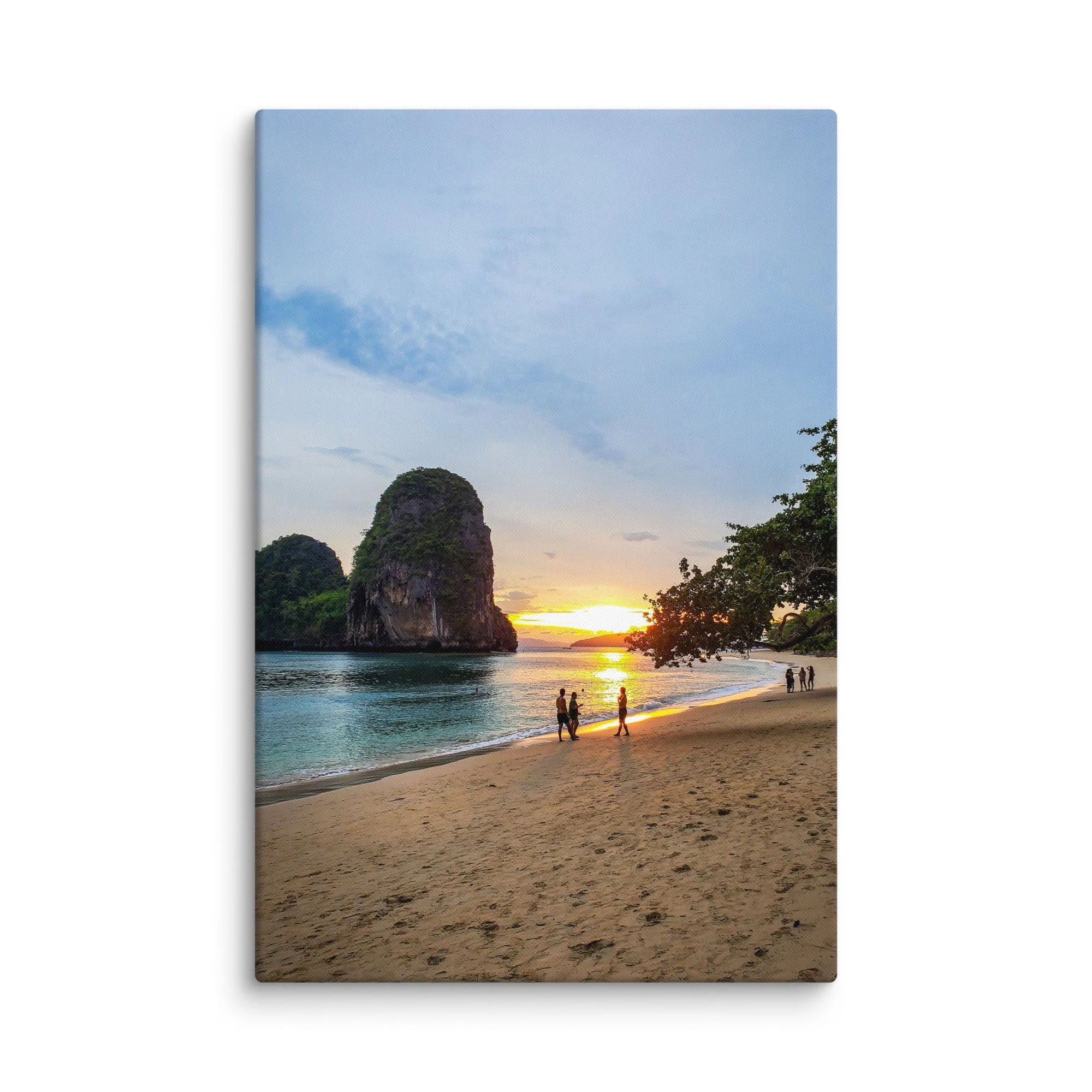 Sunset over turquoise sea at Railay or Phra Nang Beach, Krabi, Thailand with karst formations, longtail boats and people strolling on the sand – tropical travel photography canvas print