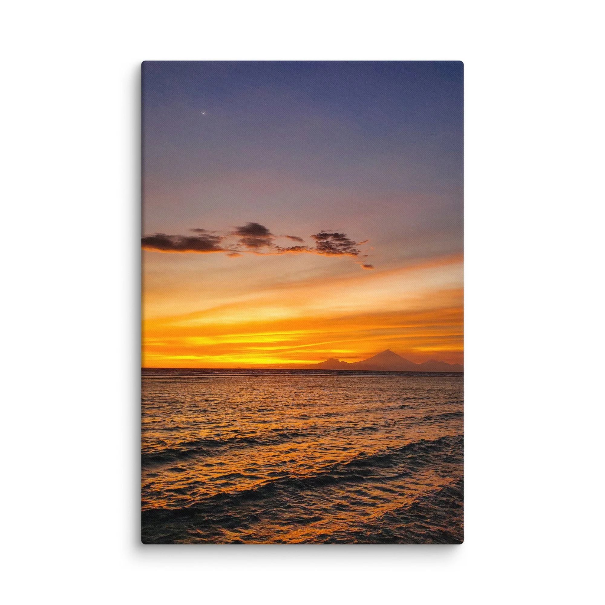 Sunset over tranquil beach with silhouette of Mount Rinjani (or Agung) volcano and crescent moon in Indonesia – tropical travel photography canvas print wall art decor