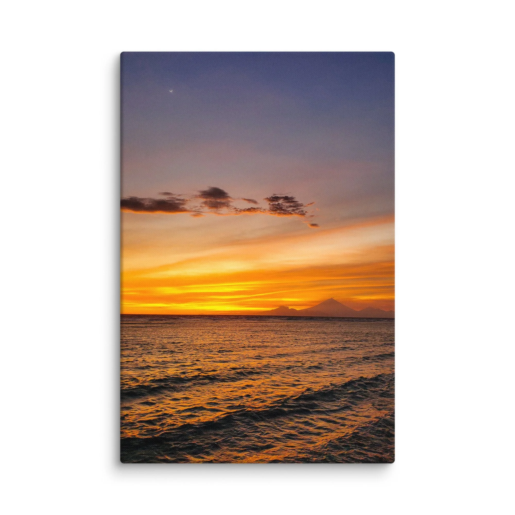 Sunset over tranquil beach with silhouette of Mount Rinjani (or Agung) volcano and crescent moon in Indonesia – tropical travel photography canvas print wall art decor