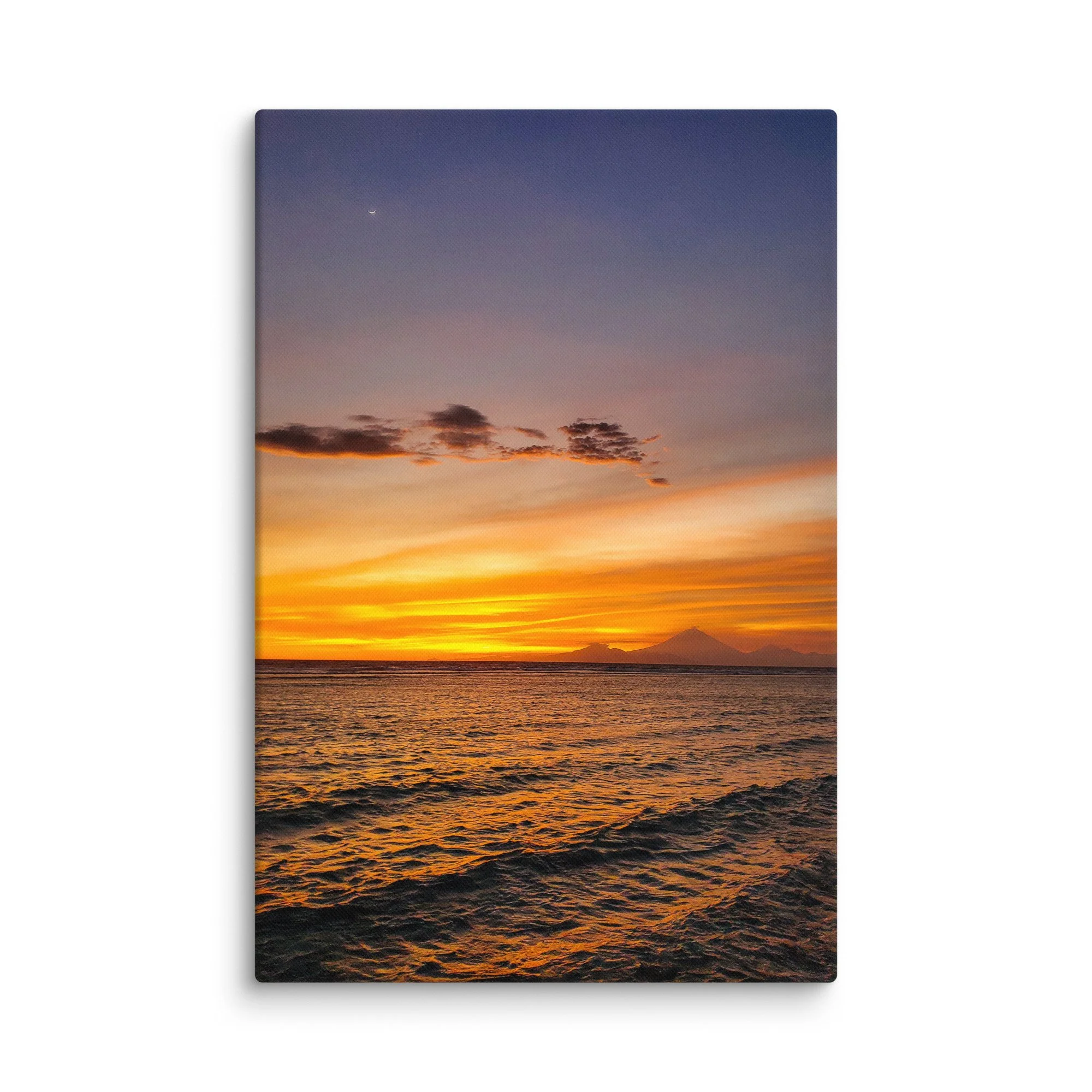 Sunset over tranquil beach with silhouette of Mount Rinjani (or Agung) volcano and crescent moon in Indonesia – tropical travel photography canvas print wall art decor