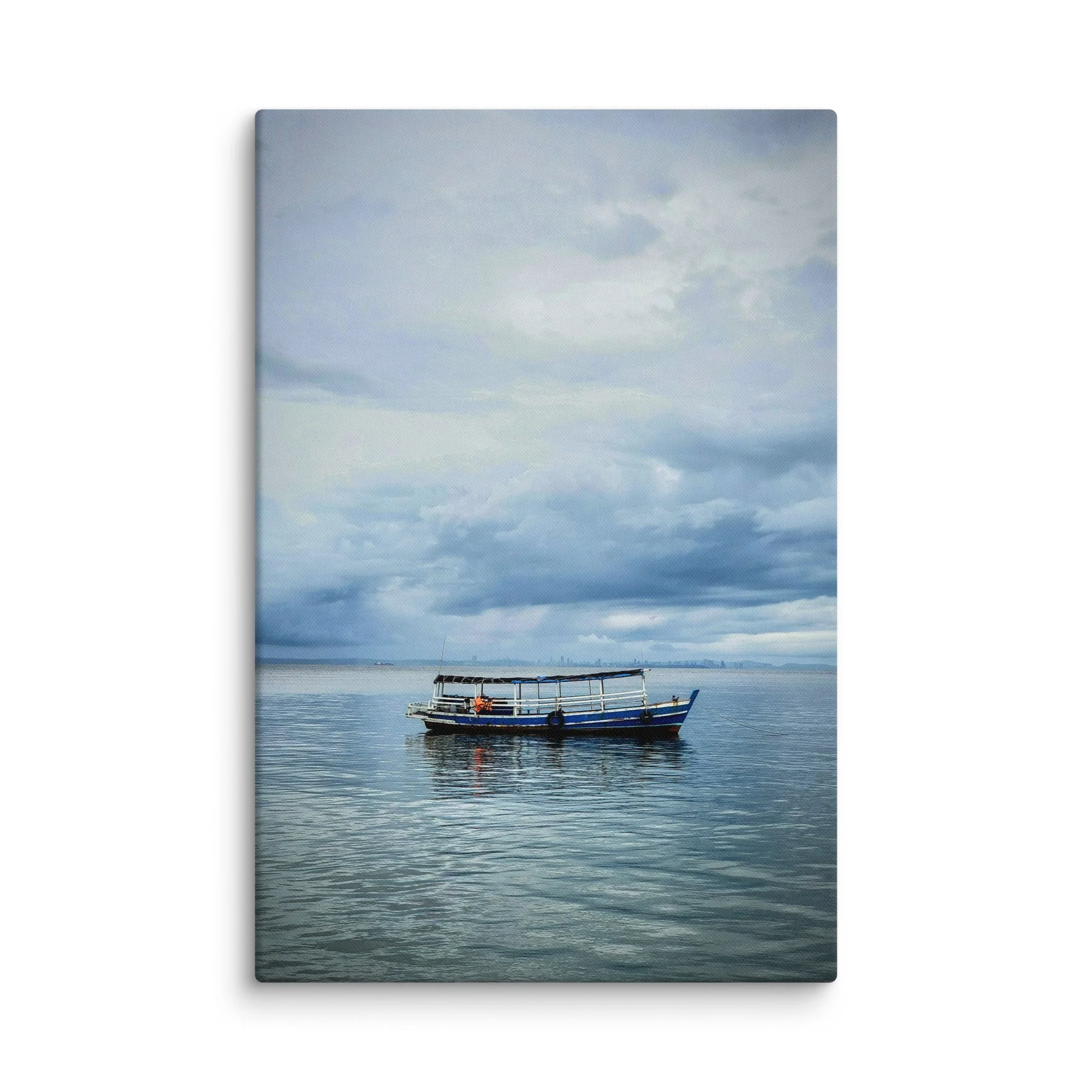 Classic blue-and-white wooden boat floating on calm sea under dramatic cloudy sky in Thailand – tropical travel photography canvas print wall art decor