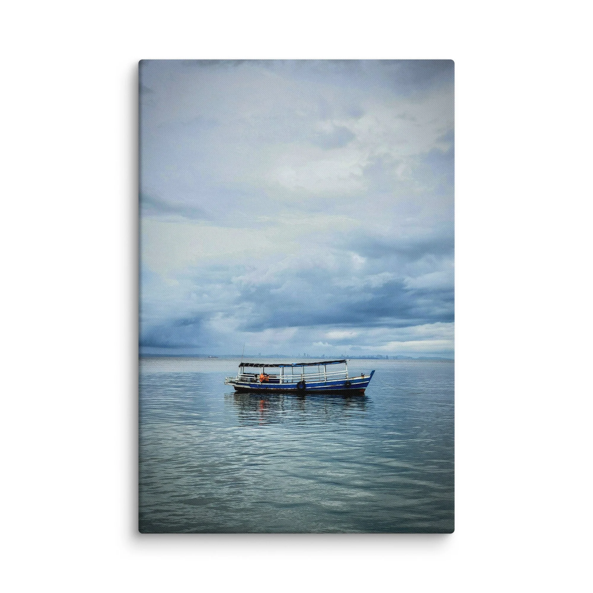 Classic blue-and-white wooden boat floating on calm sea under dramatic cloudy sky in Thailand – tropical travel photography canvas print wall art decor