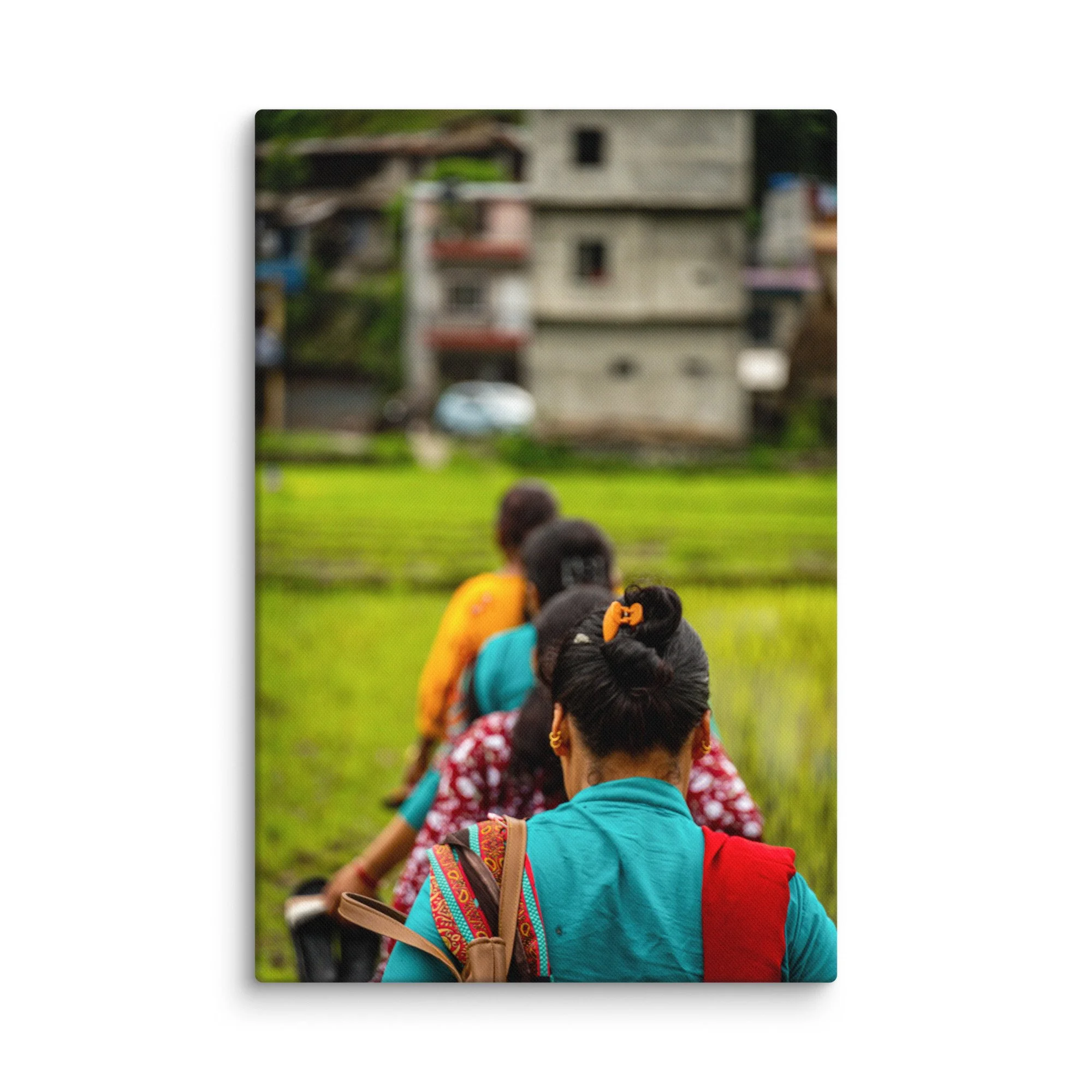Group of Nepali women walking along a path through green rice paddies in traditional colorful clothing, back view – Himalayan cultural travel photography canvas print wall art decor