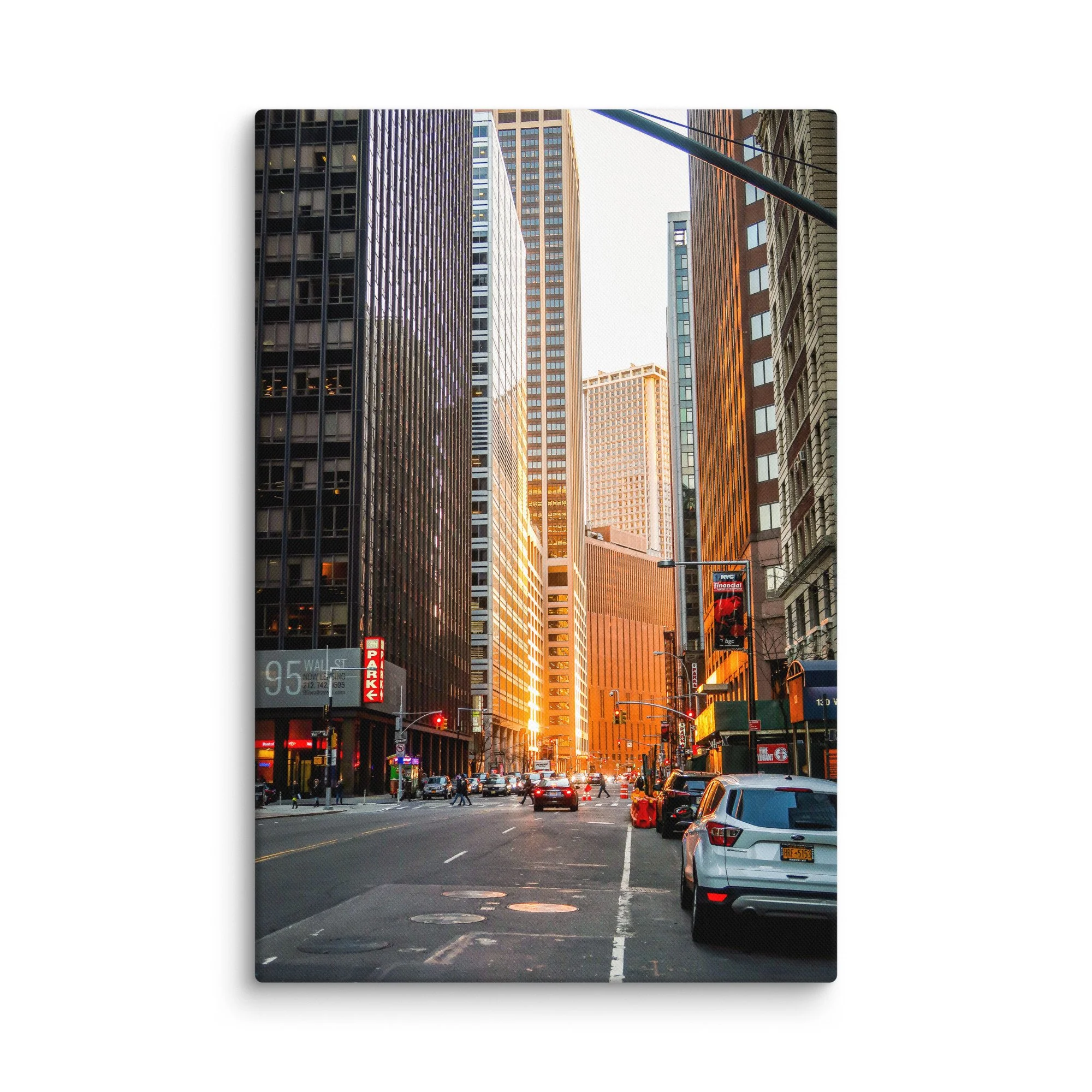 Iconic Wall Street in New York City with towering skyscrapers glowing in golden hour light, yellow taxis and pedestrians – urban travel photography canvas print wall art decor