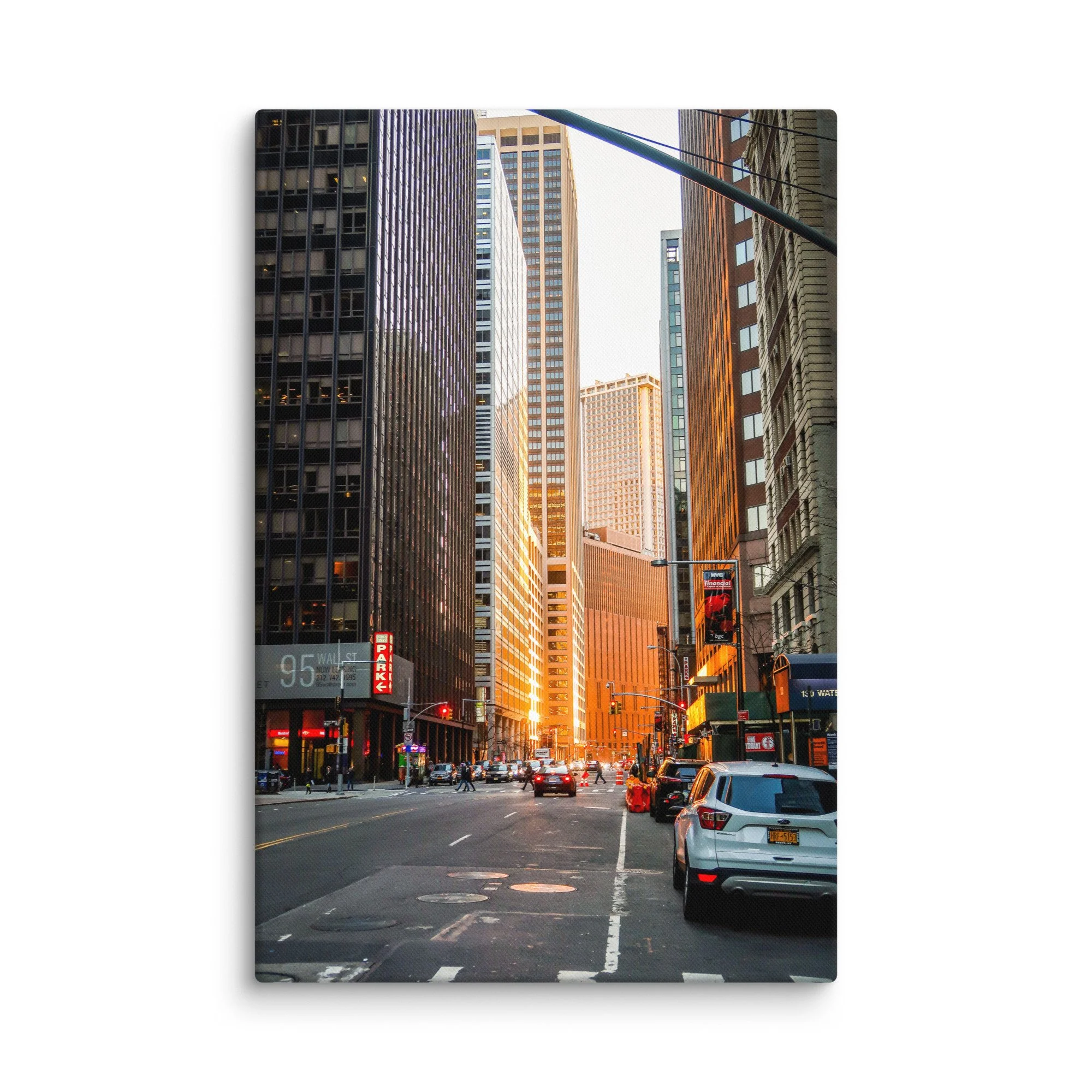 Iconic Wall Street in New York City with towering skyscrapers glowing in golden hour light, yellow taxis and pedestrians – urban travel photography canvas print wall art decor