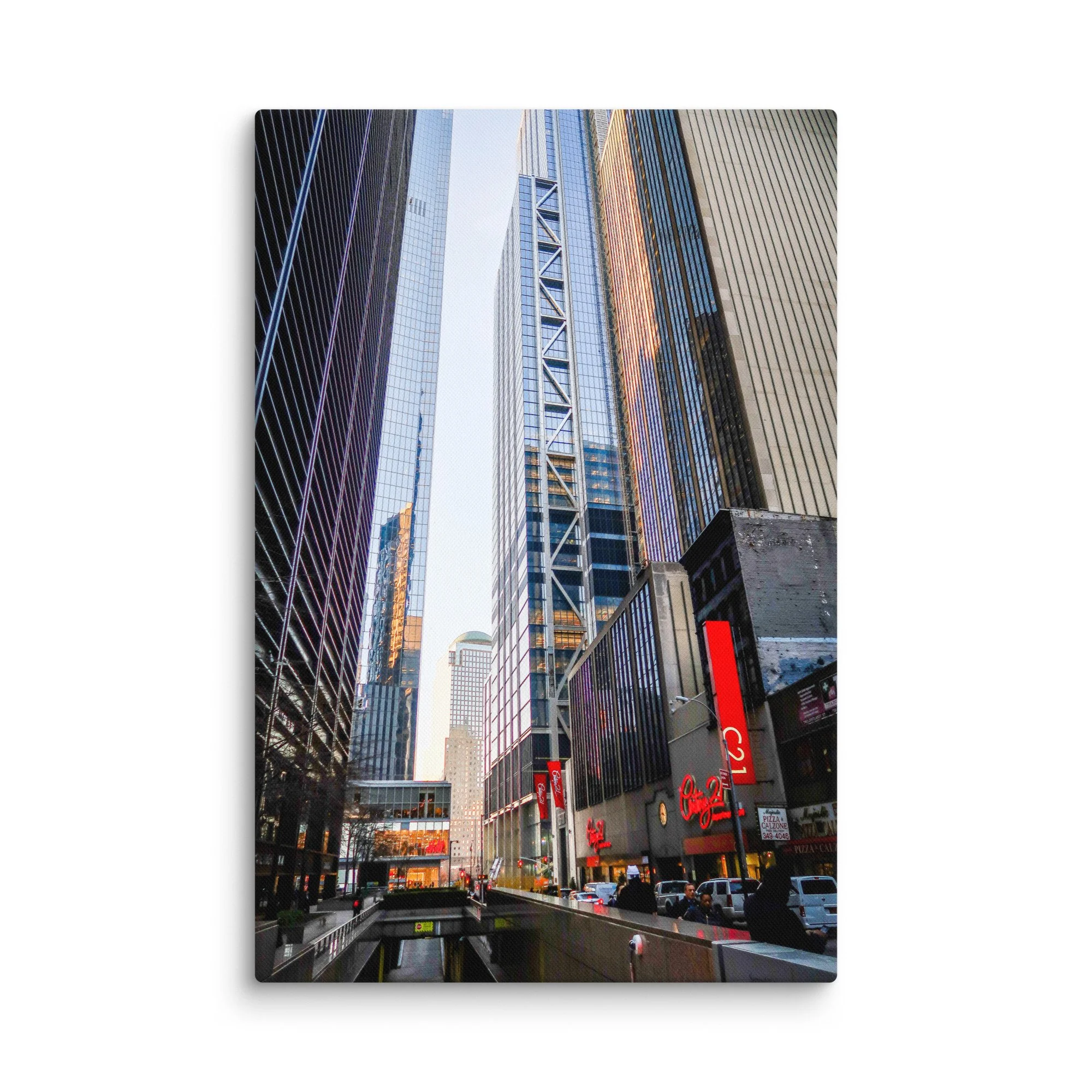 Dramatic upward view of towering skyscrapers in Wall Street, New York City, with golden light and blue sky – urban travel photography canvas print wall art decor