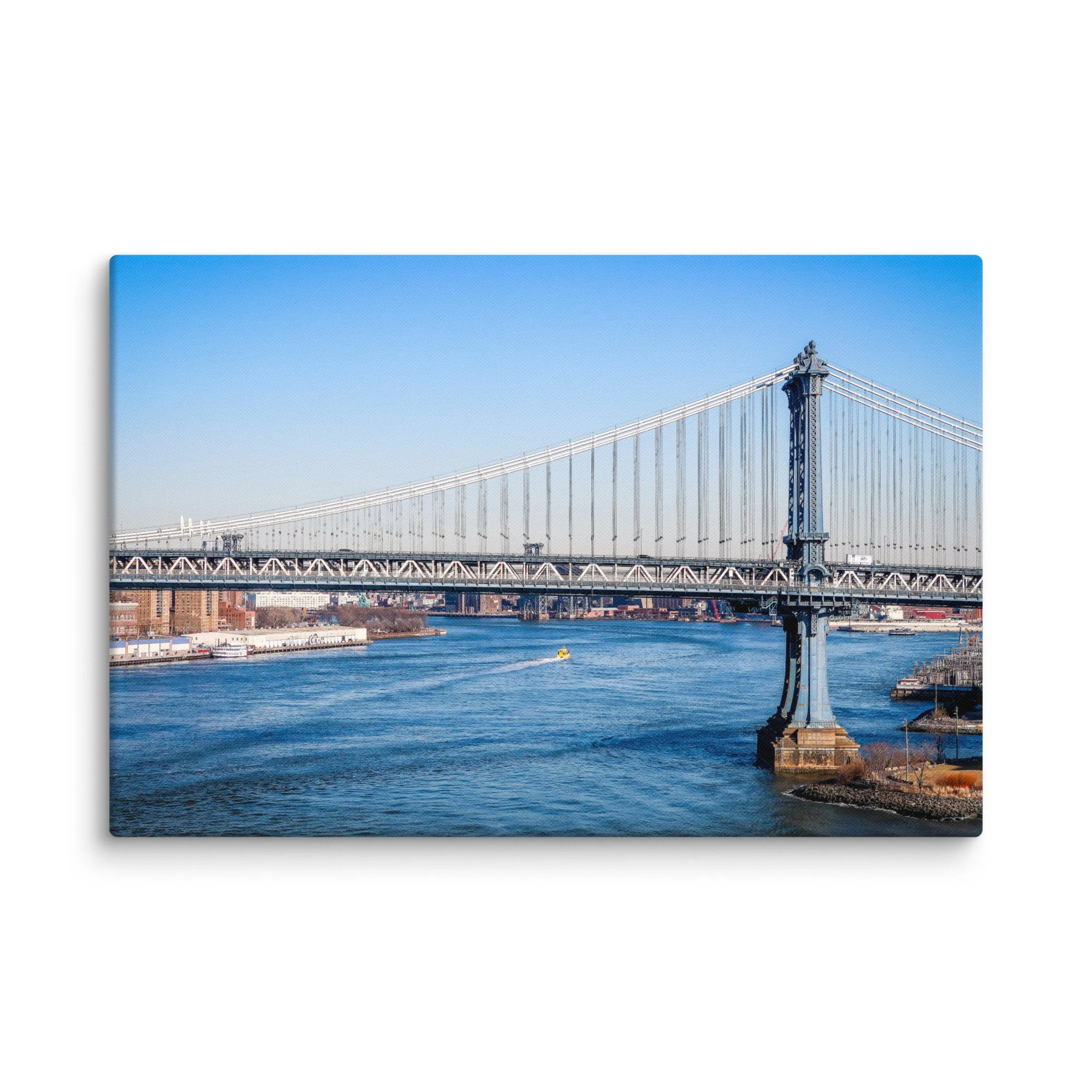 Iconic Manhattan Bridge viewed from Brooklyn, New York City with full skyline, East River and yellow water taxi under blue sky – urban travel photography canvas print wall art decor