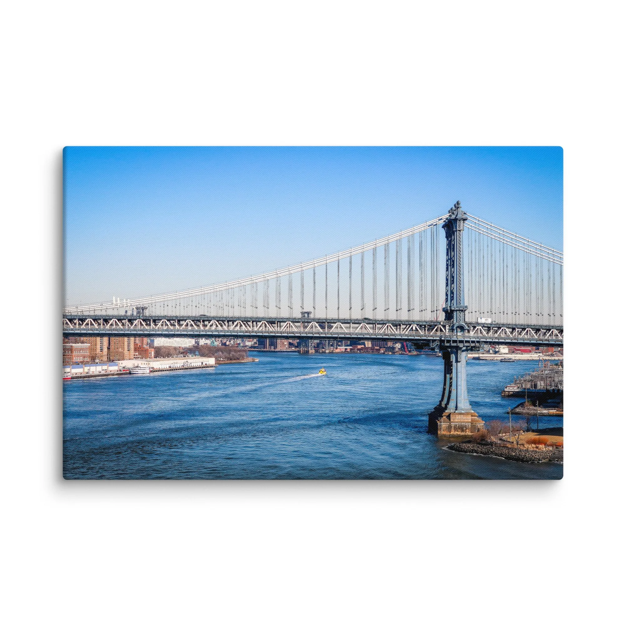 Iconic Manhattan Bridge viewed from Brooklyn, New York City with full skyline, East River and yellow water taxi under blue sky – urban travel photography canvas print wall art decor