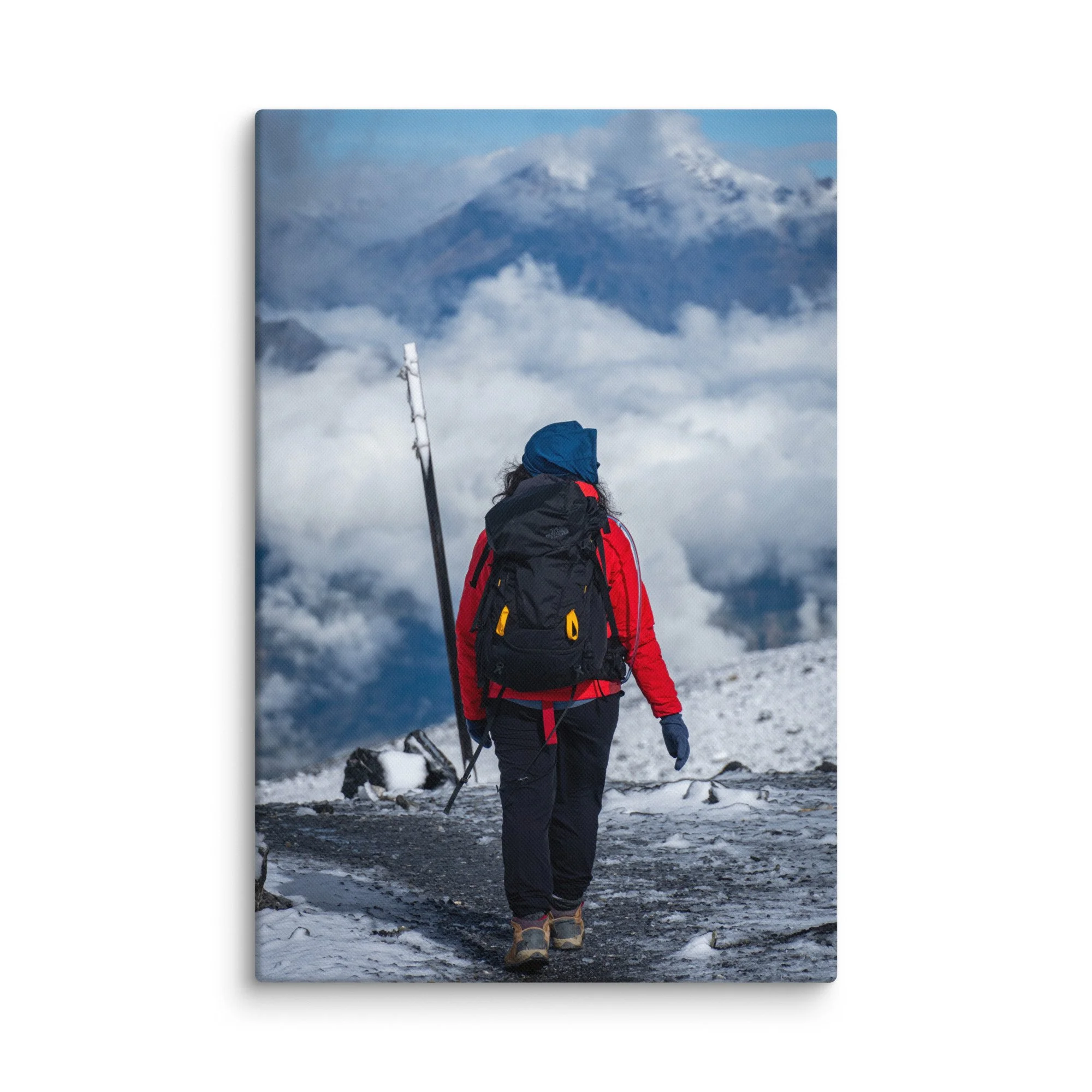 Female trekker standing at Thorong La Pass on the Annapurna Circuit, Nepal, overlooking dramatic Himalayan peaks and sea of clouds – high-altitude trekking travel photography canvas print
