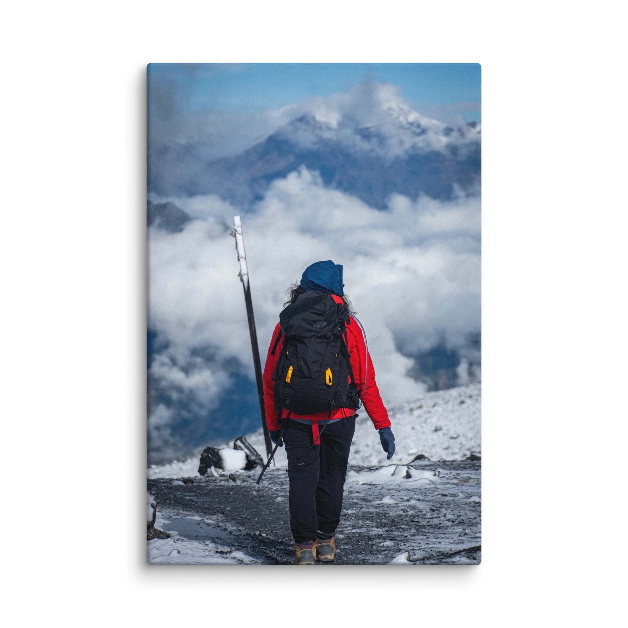 Female trekker standing at Thorong La Pass on the Annapurna Circuit, Nepal, overlooking dramatic Himalayan peaks and sea of clouds – high-altitude trekking travel photography canvas print