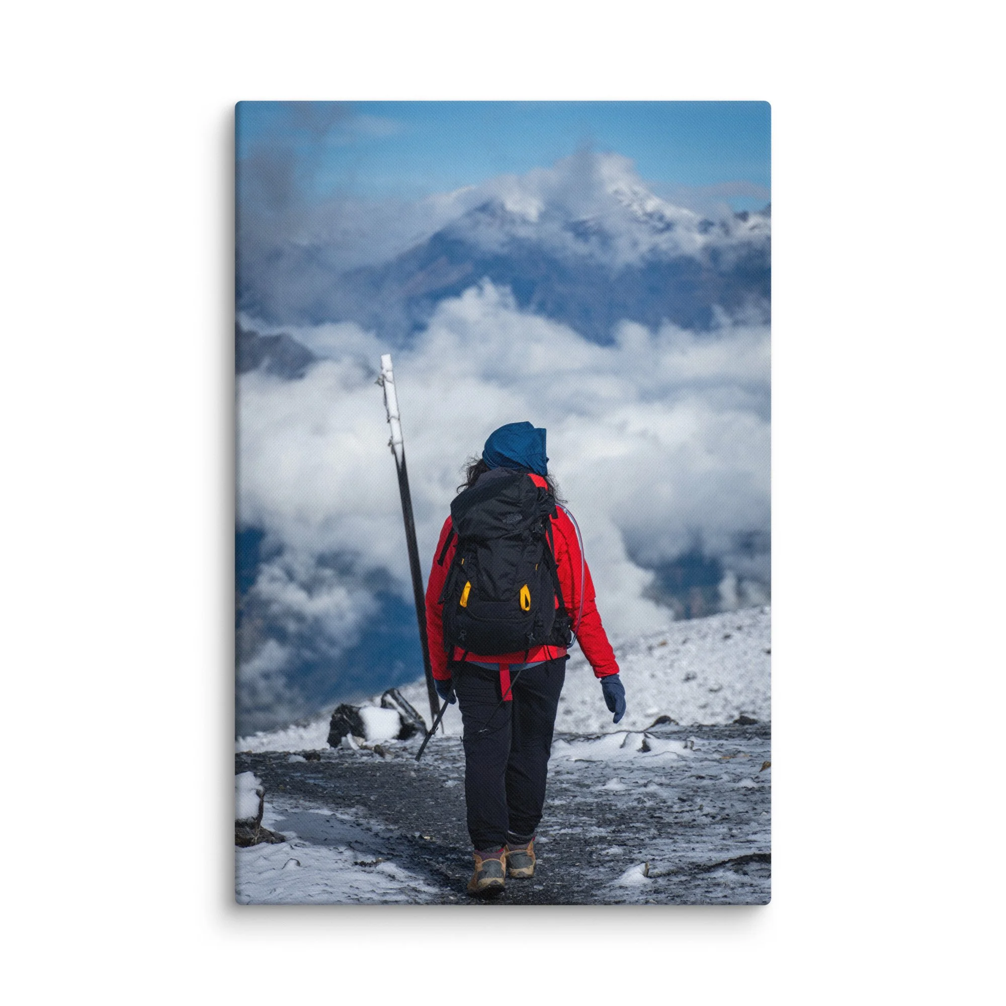 Female trekker standing at Thorong La Pass on the Annapurna Circuit, Nepal, overlooking dramatic Himalayan peaks and sea of clouds – high-altitude trekking travel photography canvas print