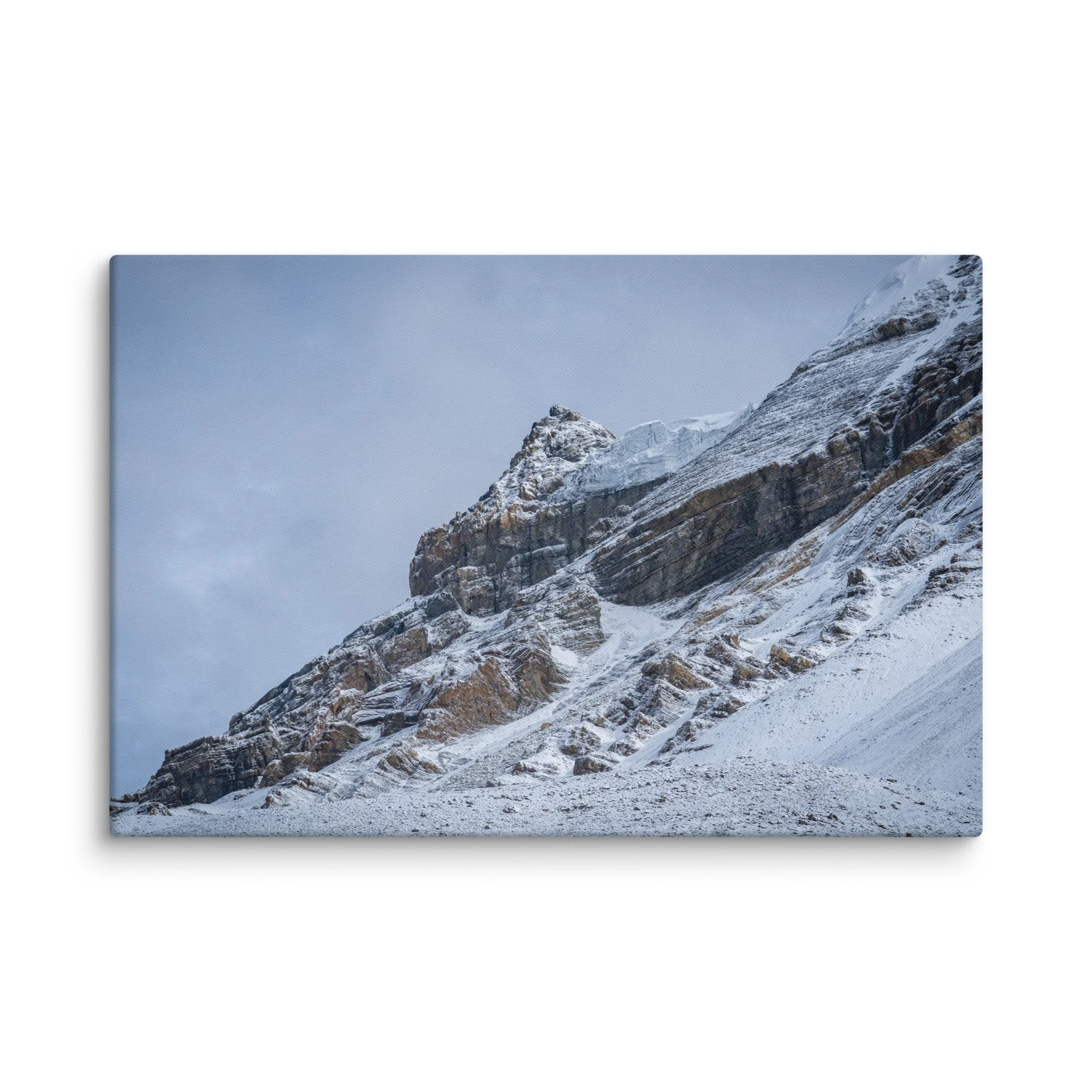 Snow-covered high ridge on the Annapurna Circuit, Nepal with dramatic Himalayan peaks and moody sky – trekking travel photography canvas print wall art decor