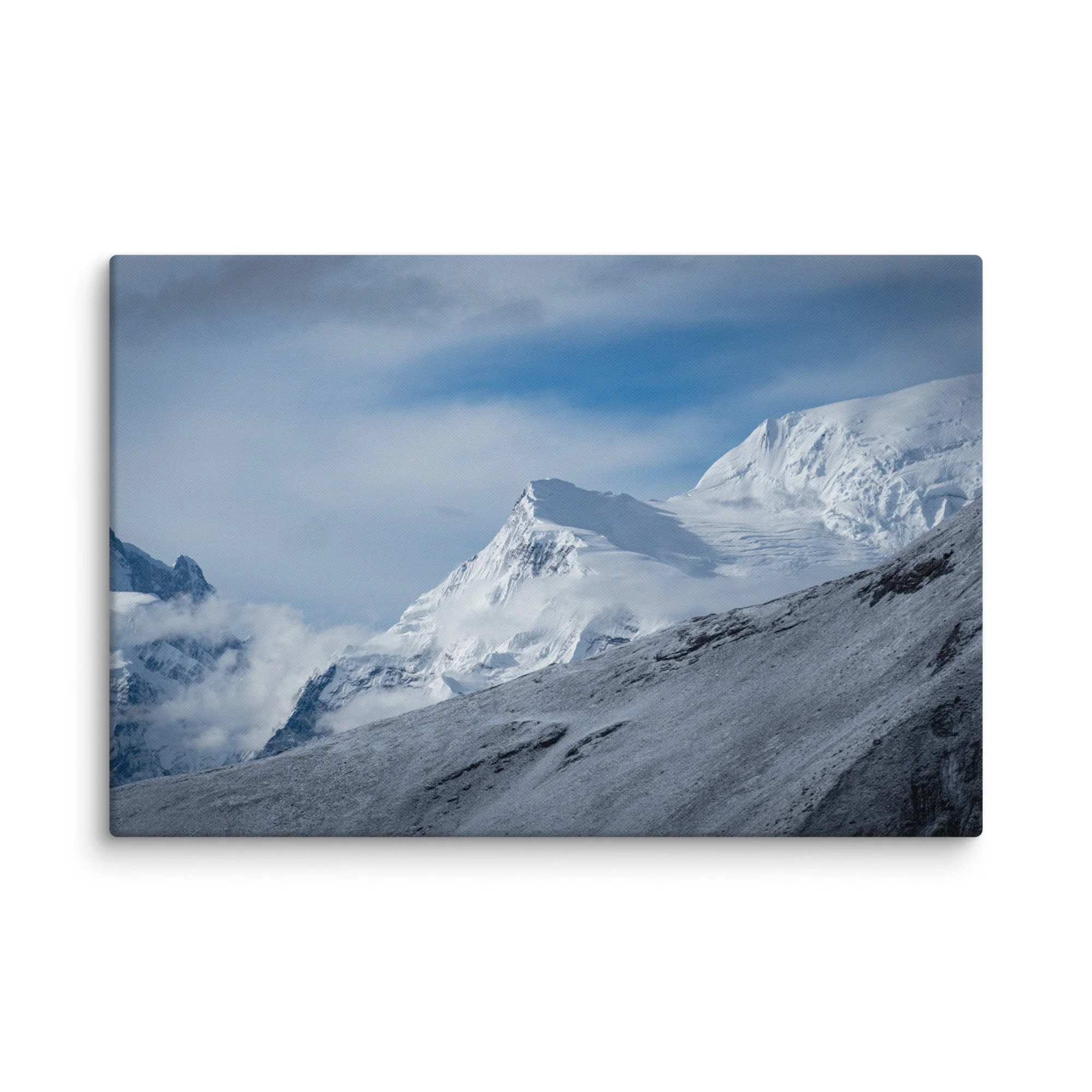 Snow-covered high ridge on the Annapurna Circuit, Nepal with dramatic Himalayan peaks and moody sky – trekking travel photography canvas print wall art decor