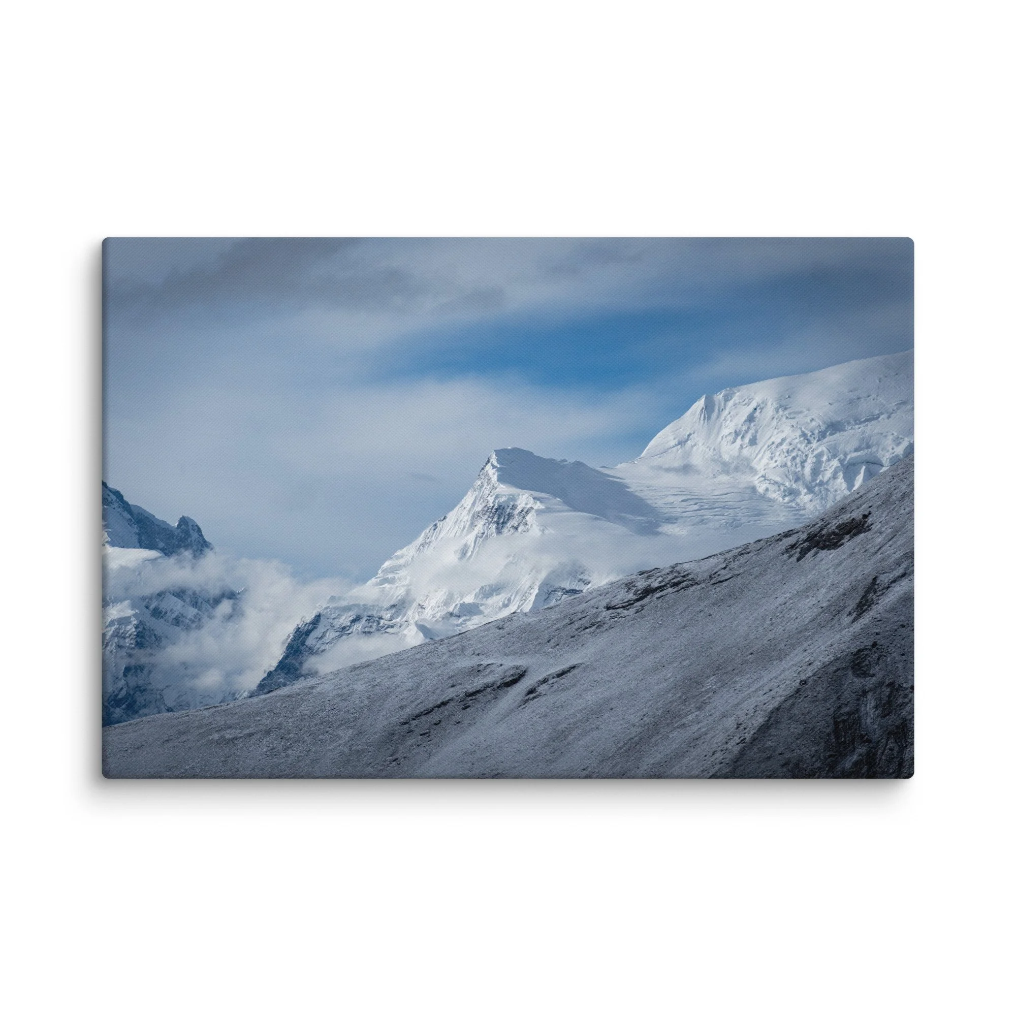Snow-covered high ridge on the Annapurna Circuit, Nepal with dramatic Himalayan peaks and moody sky – trekking travel photography canvas print wall art decor