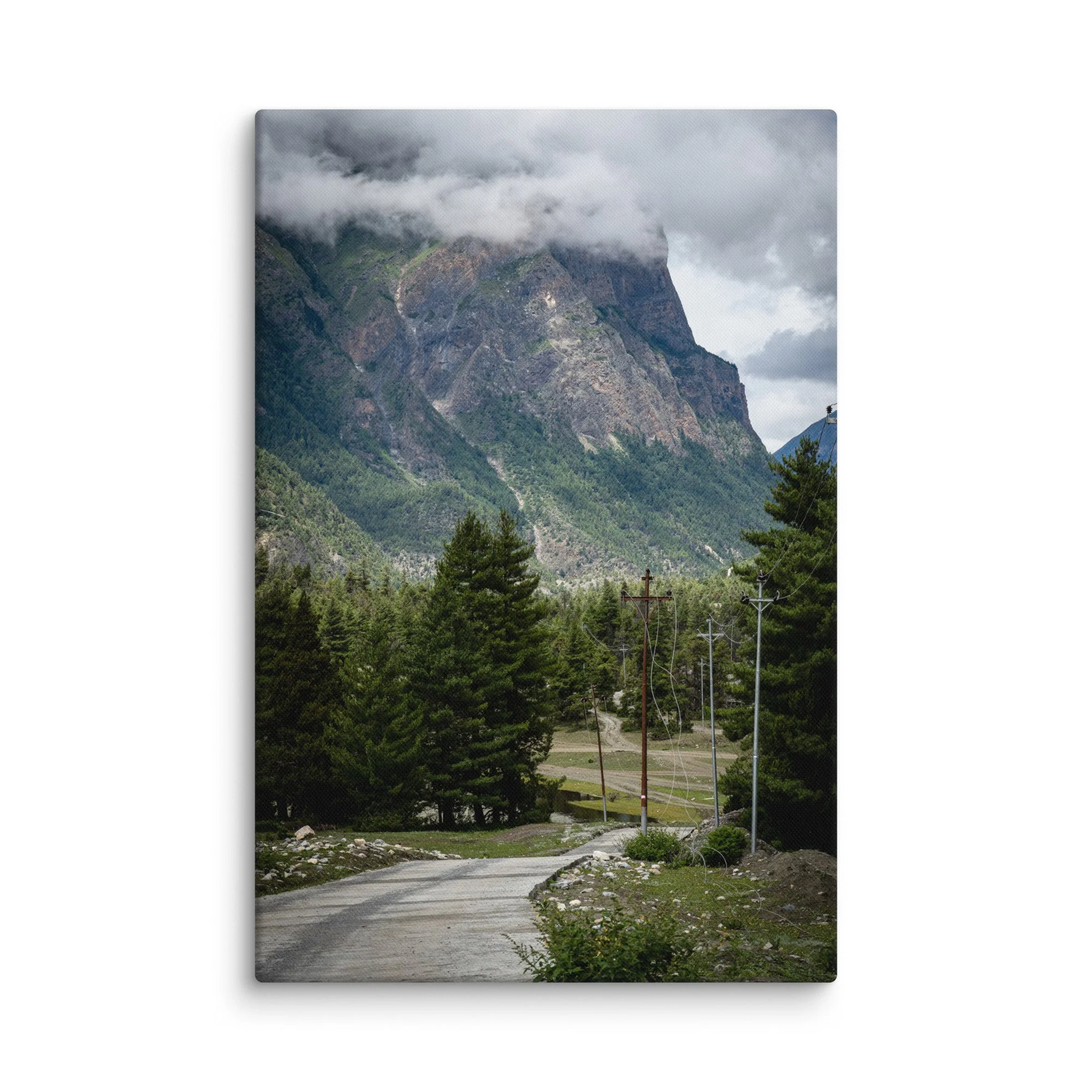 Winding mountain trail on the Annapurna Circuit, Nepal with lush pine forests and towering snow-capped Himalayan peaks under blue sky – high-altitude trekking travel photography canvas