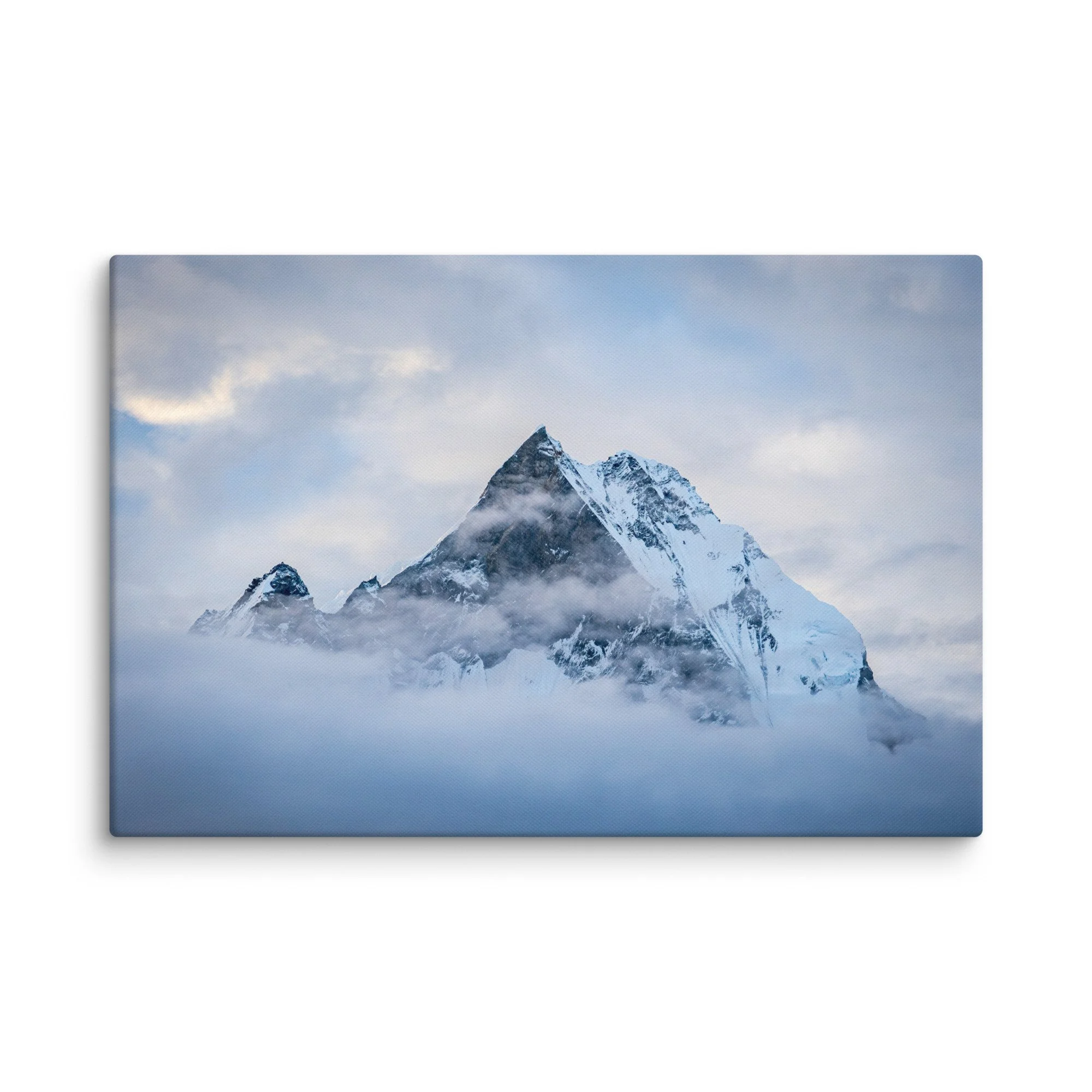 Majestic snow-covered Himalayan peak (Annapurna South or Machhapuchhre) rising through swirling clouds at Annapurna Base Camp, Nepal – high-altitude trekking spiritual travel