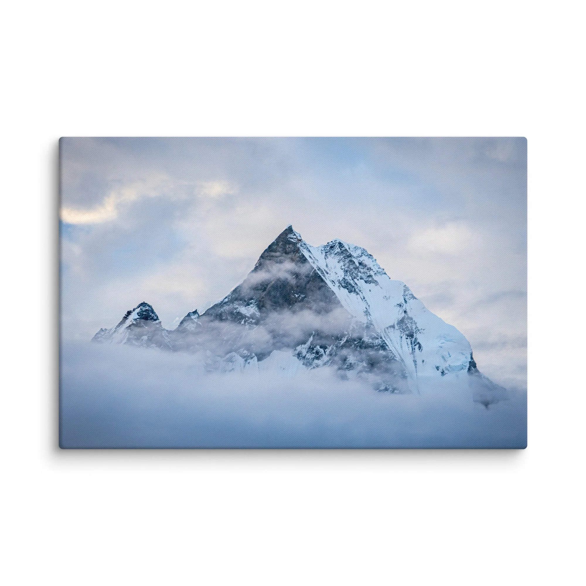 Majestic snow-covered Himalayan peak (Annapurna South or Machhapuchhre) rising through swirling clouds at Annapurna Base Camp, Nepal – high-altitude trekking spiritual travel