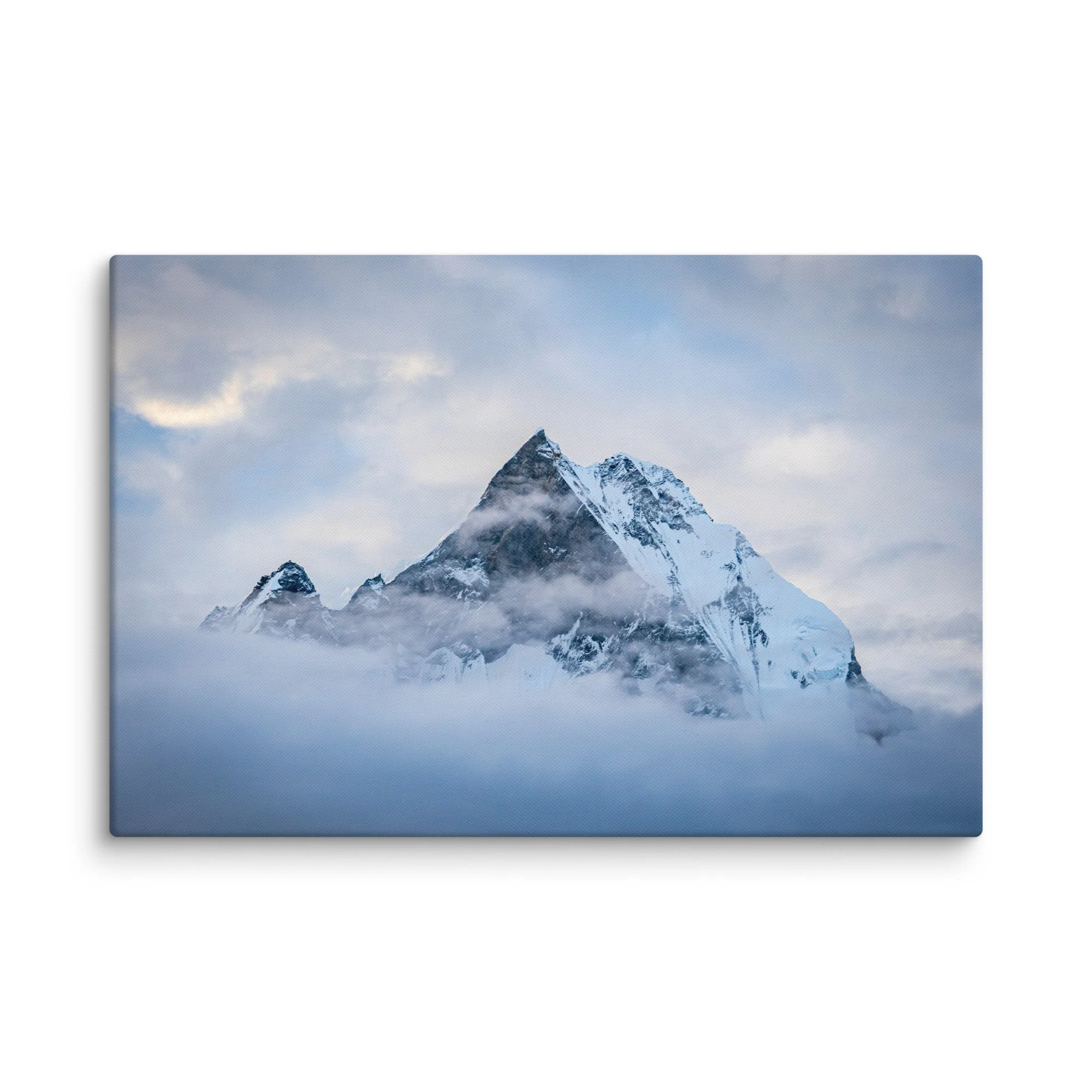 Majestic snow-covered Himalayan peak (Annapurna South or Machhapuchhre) rising through swirling clouds at Annapurna Base Camp, Nepal – high-altitude trekking spiritual travel