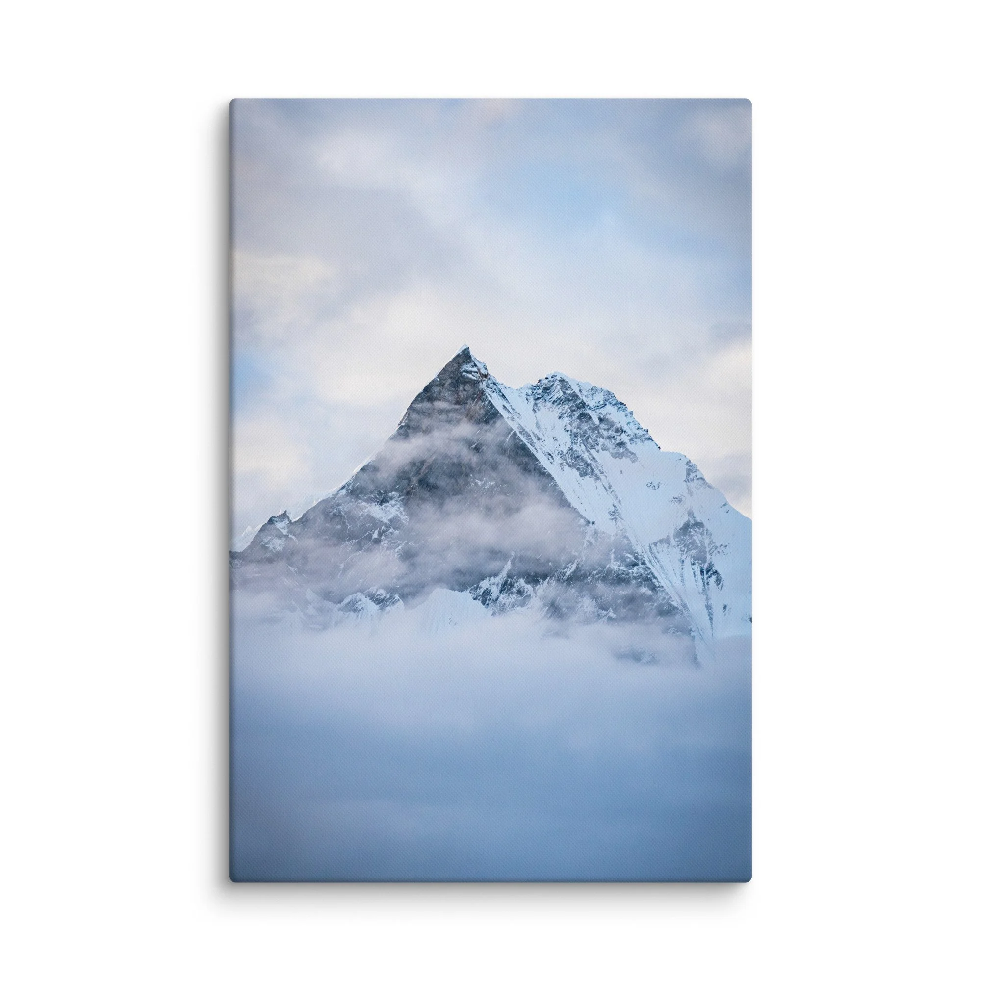 Majestic snow-covered Himalayan peak (Annapurna South or Machhapuchhre) rising through swirling clouds at Annapurna Base Camp, Nepal – high-altitude trekking spiritual travel