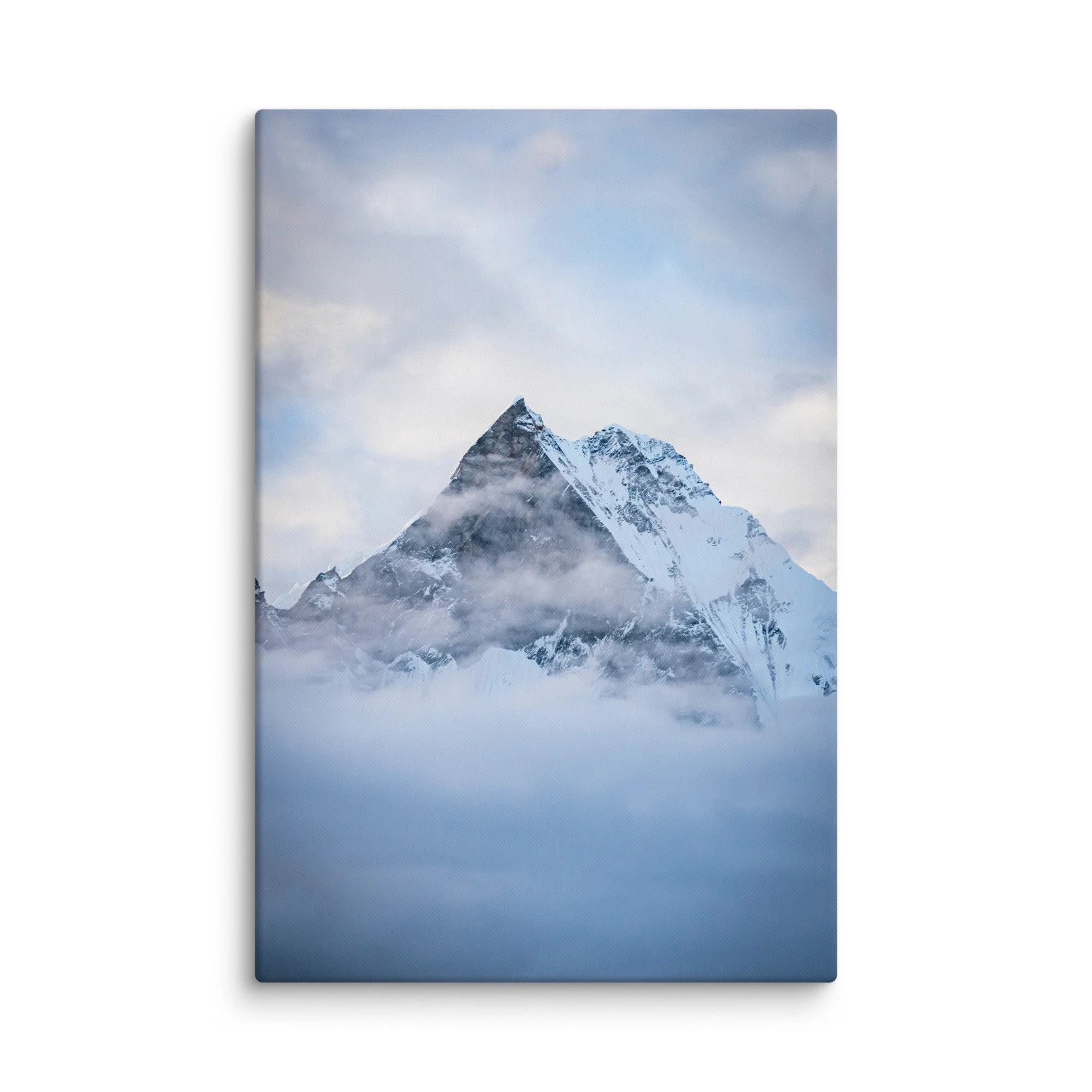 Majestic snow-covered Himalayan peak (Annapurna South or Machhapuchhre) rising through swirling clouds at Annapurna Base Camp, Nepal – high-altitude trekking spiritual travel
