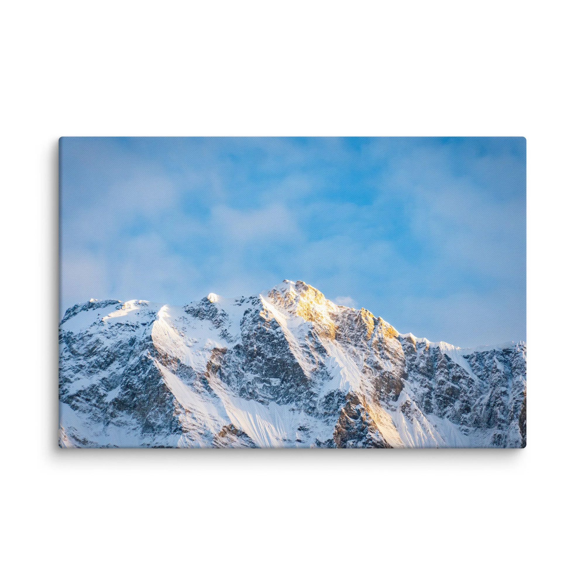 Majestic snow-covered Himalayan peak (Annapurna South or Machhapuchhre) glowing in golden sunset light through clouds at Annapurna Base Camp, Nepal – high-altitude trekking spiritual