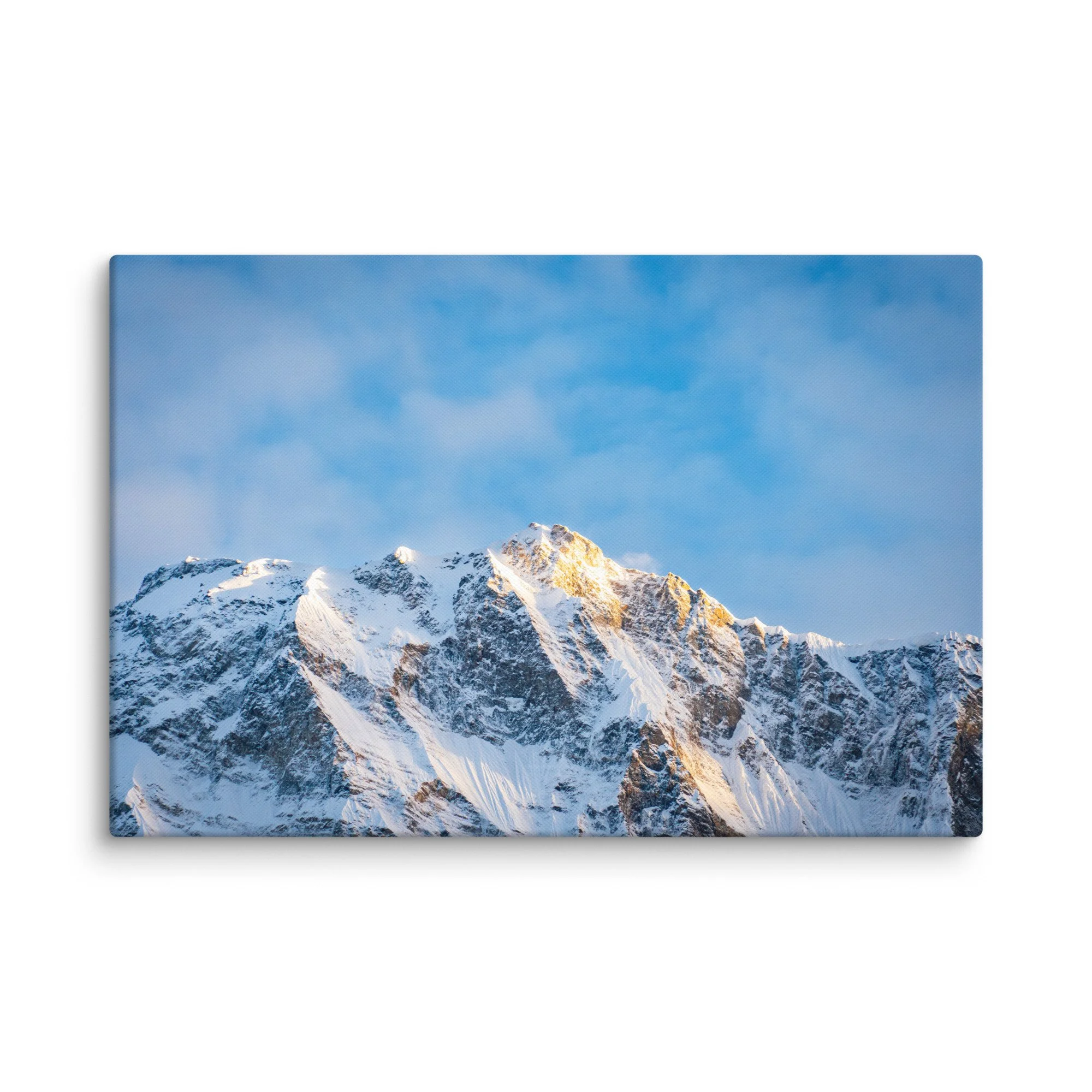 Majestic snow-covered Himalayan peak (Annapurna South or Machhapuchhre) glowing in golden sunset light through clouds at Annapurna Base Camp, Nepal – high-altitude trekking spiritual