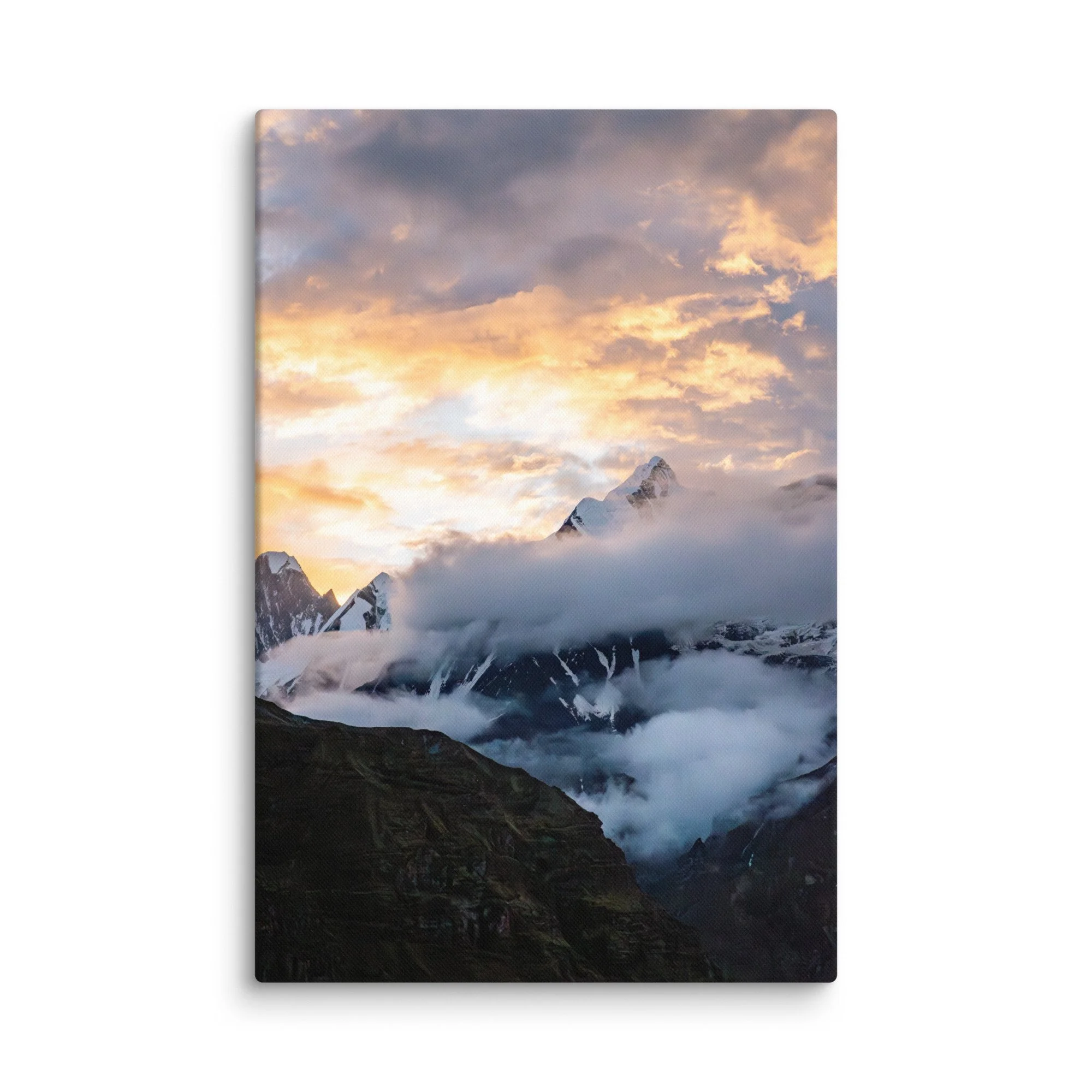 Dramatic snow-covered Himalayan peaks (Annapurna South and Machhapuchhre) glowing in golden sunset light through clouds at Annapurna Base Camp, Nepal – high-altitude trekking