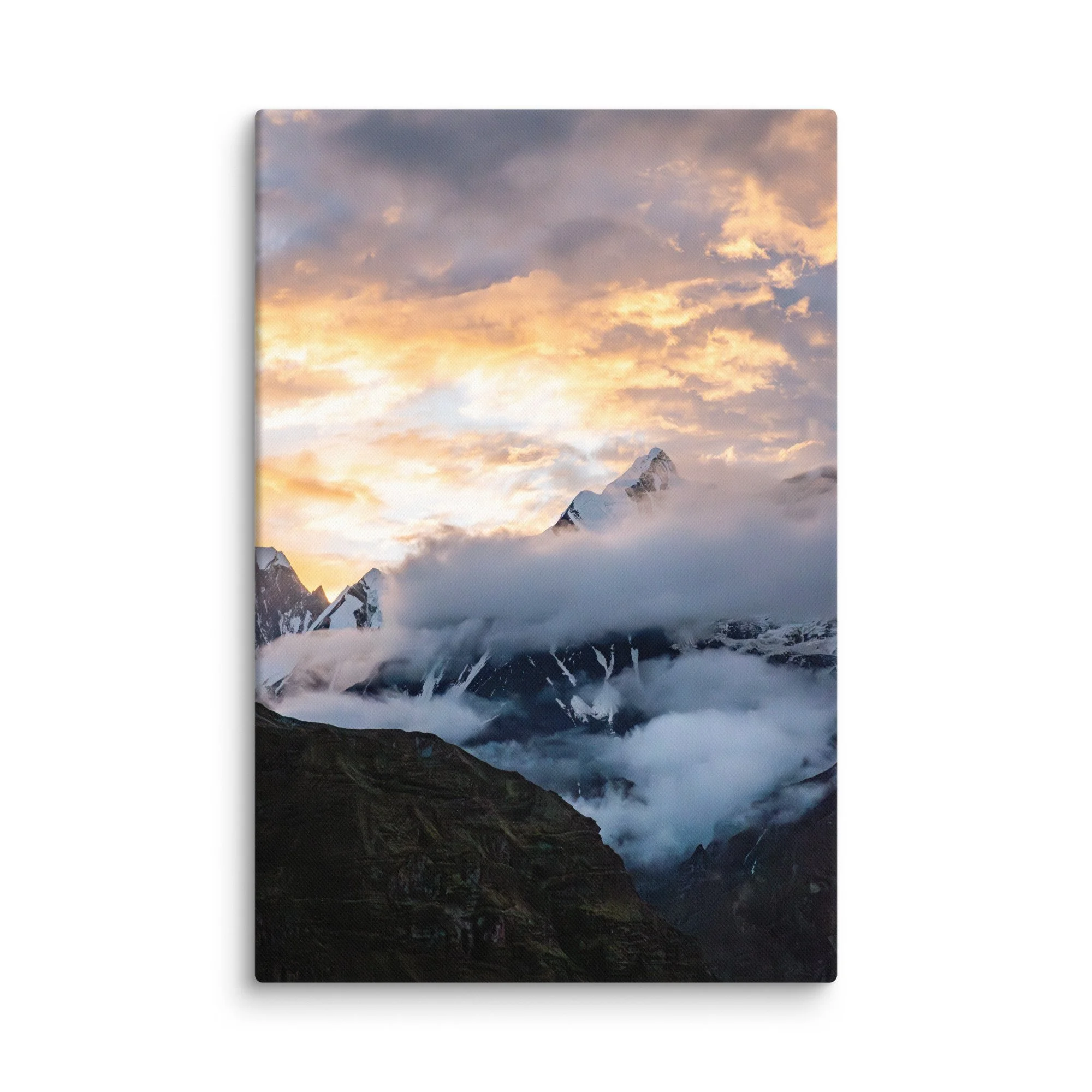 Dramatic snow-covered Himalayan peaks (Annapurna South and Machhapuchhre) glowing in golden sunset light through clouds at Annapurna Base Camp, Nepal – high-altitude trekking
